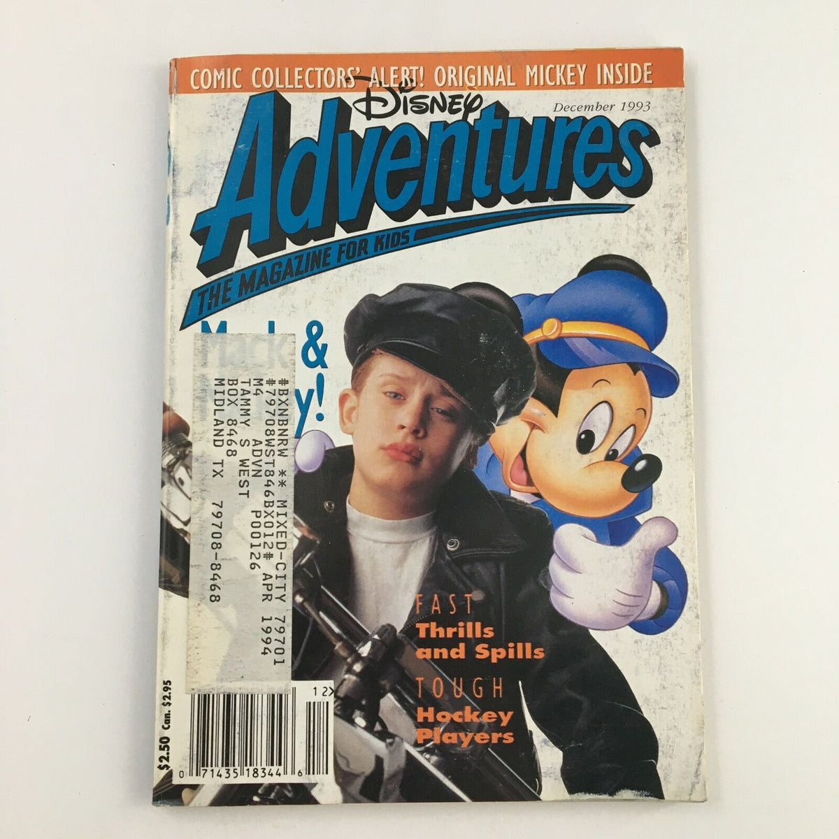 Disney Adventures Magazine December 1993 featuring Macaulay Culkin and Mickey Mouse on the cover, showcasing a nostalgic design from the early '90s.