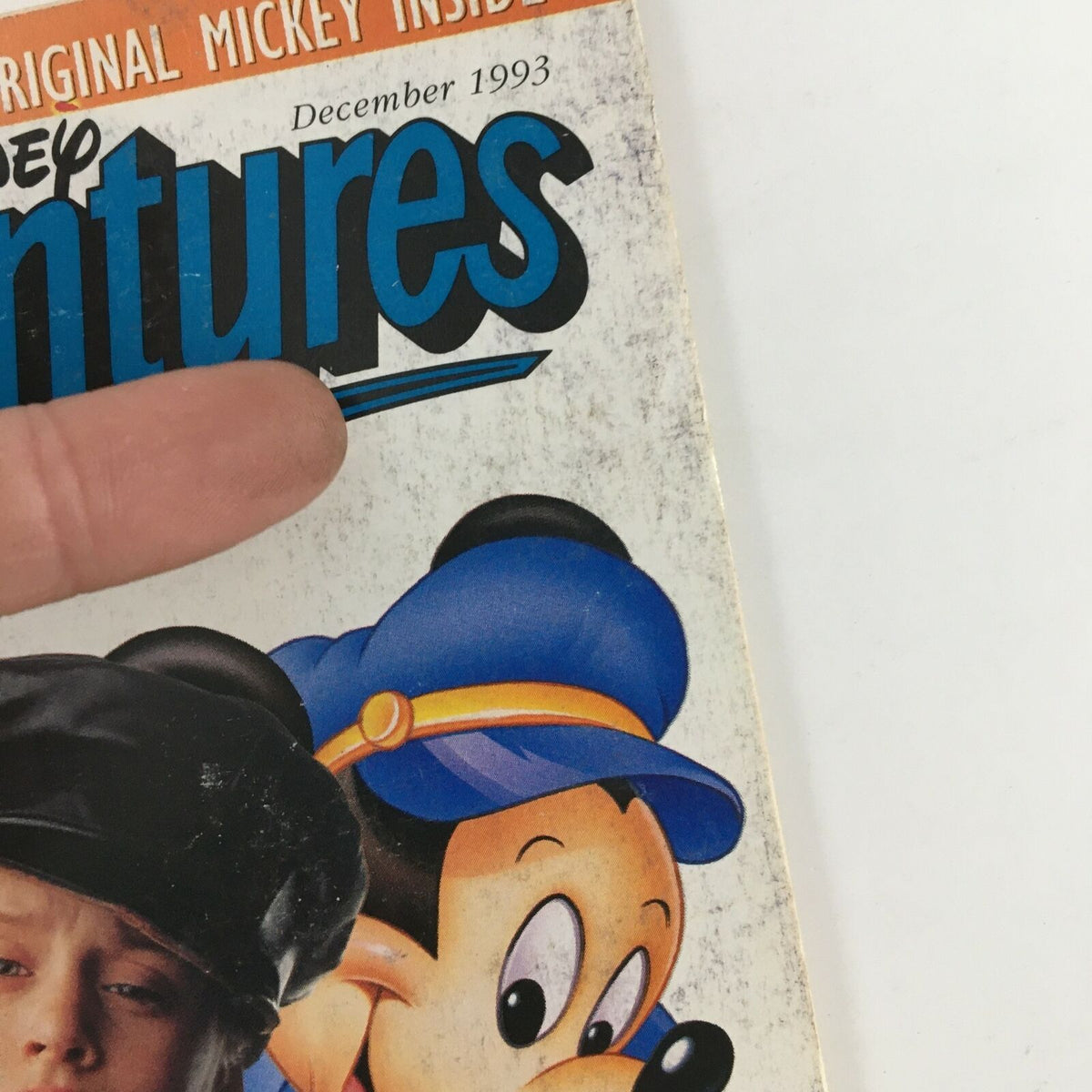 Close-up view of the Disney Adventures Magazine December 1993 cover, highlighting Macaulay Culkin and Mickey Mouse with vintage details.