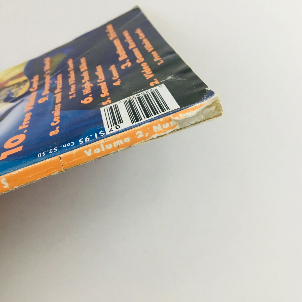 Close-up of the spine of Disney Adventures Magazine July 1992, detailing the volume number and price, with visible minor wear typical for items of its age.