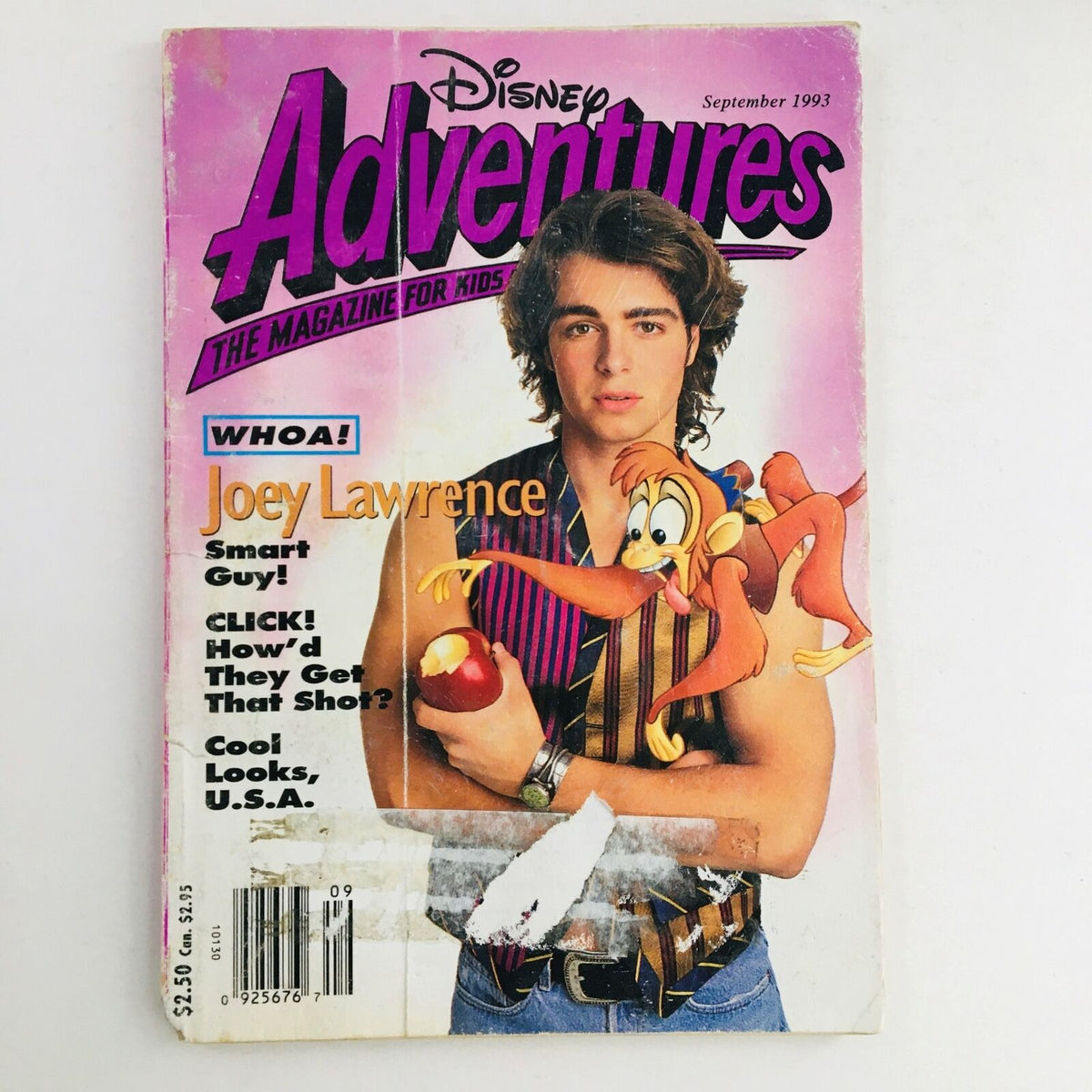 Disney Adventures Magazine September 1993 cover featuring Joey Lawrence, showcasing vibrant graphics and a playful illustration with characters, making it a collectible for Disney fans.