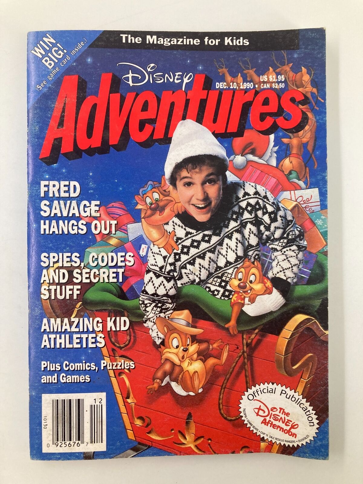 Cover of Disney Adventures Magazine from December 10, 1990, featuring Fred Savage in a festive sweater surrounded by Disney characters like Chip and Dale, promoting an entertaining edition for kids.