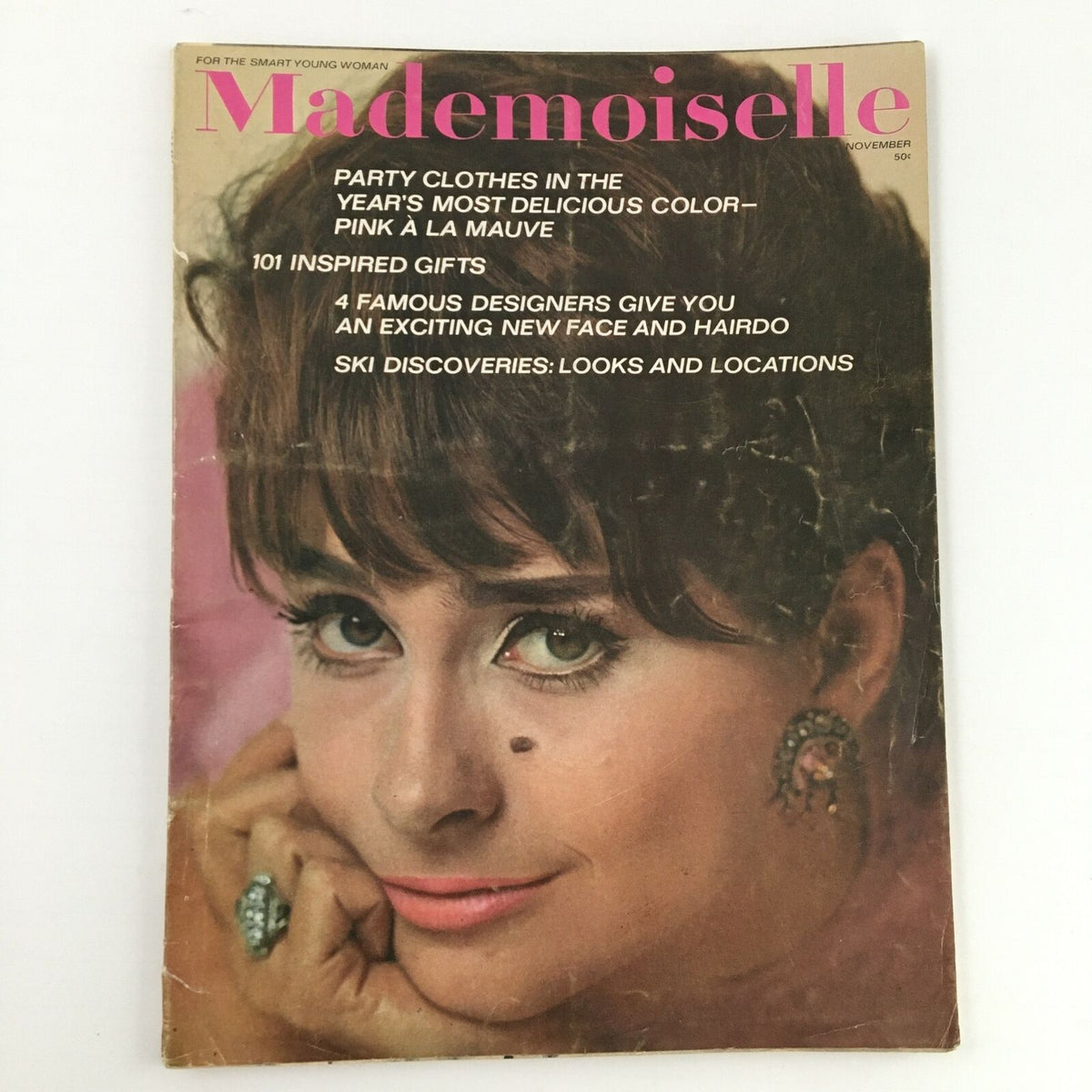Mademoiselle Magazine November 1962 featuring actress Elizabeth Ashley on the cover, showcasing a vintage style with party clothing ideas and fashion insights from the early 1960s.