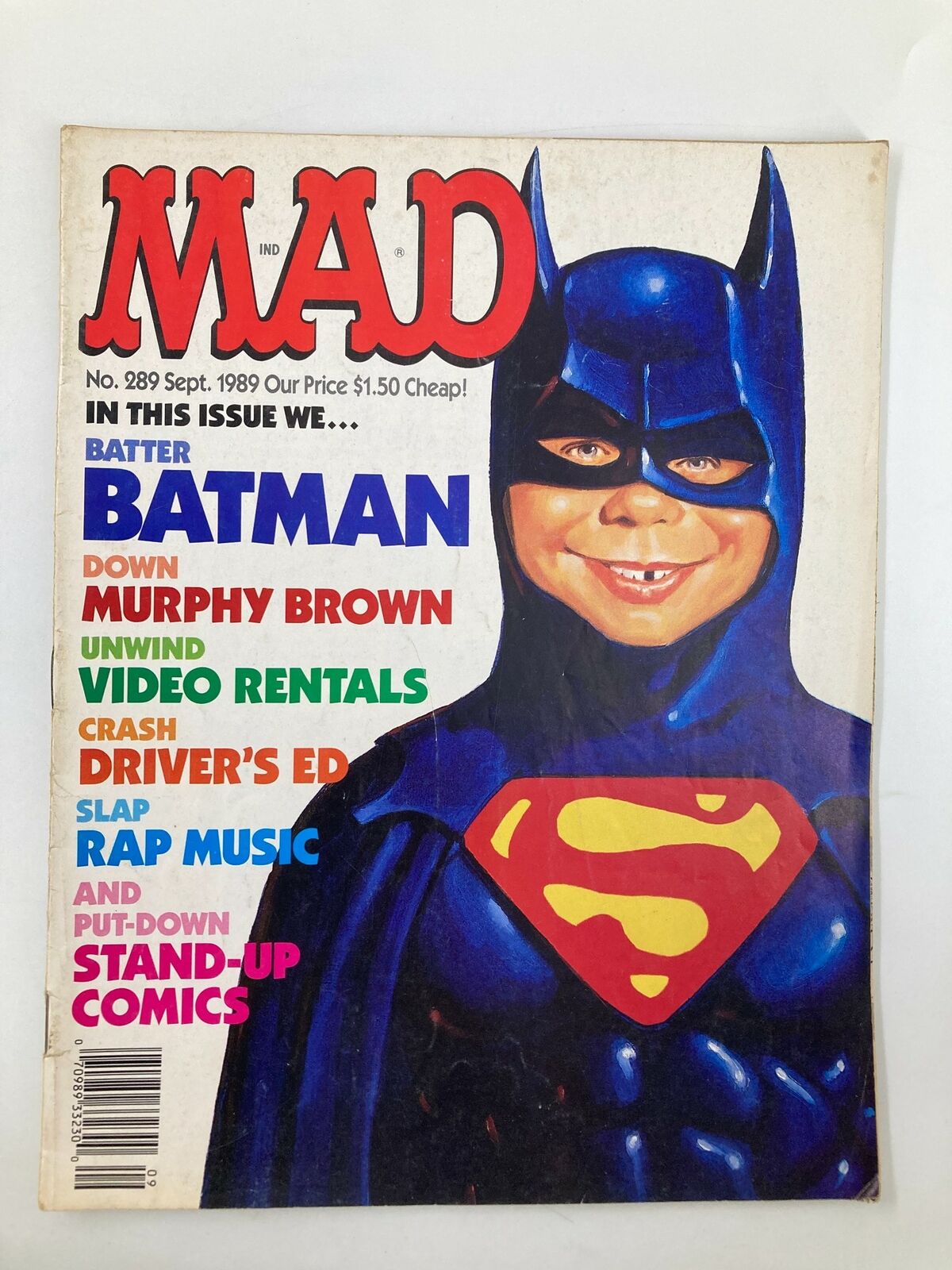 Cover of Mad Magazine No. 289, September 1989 titled 'We Batter Batman'. The cover features a humorous illustration of a child in a Batman costume with a grin, highlighting the comedic take on superhero culture. The magazine promotes various pop culture topics including music and TV.