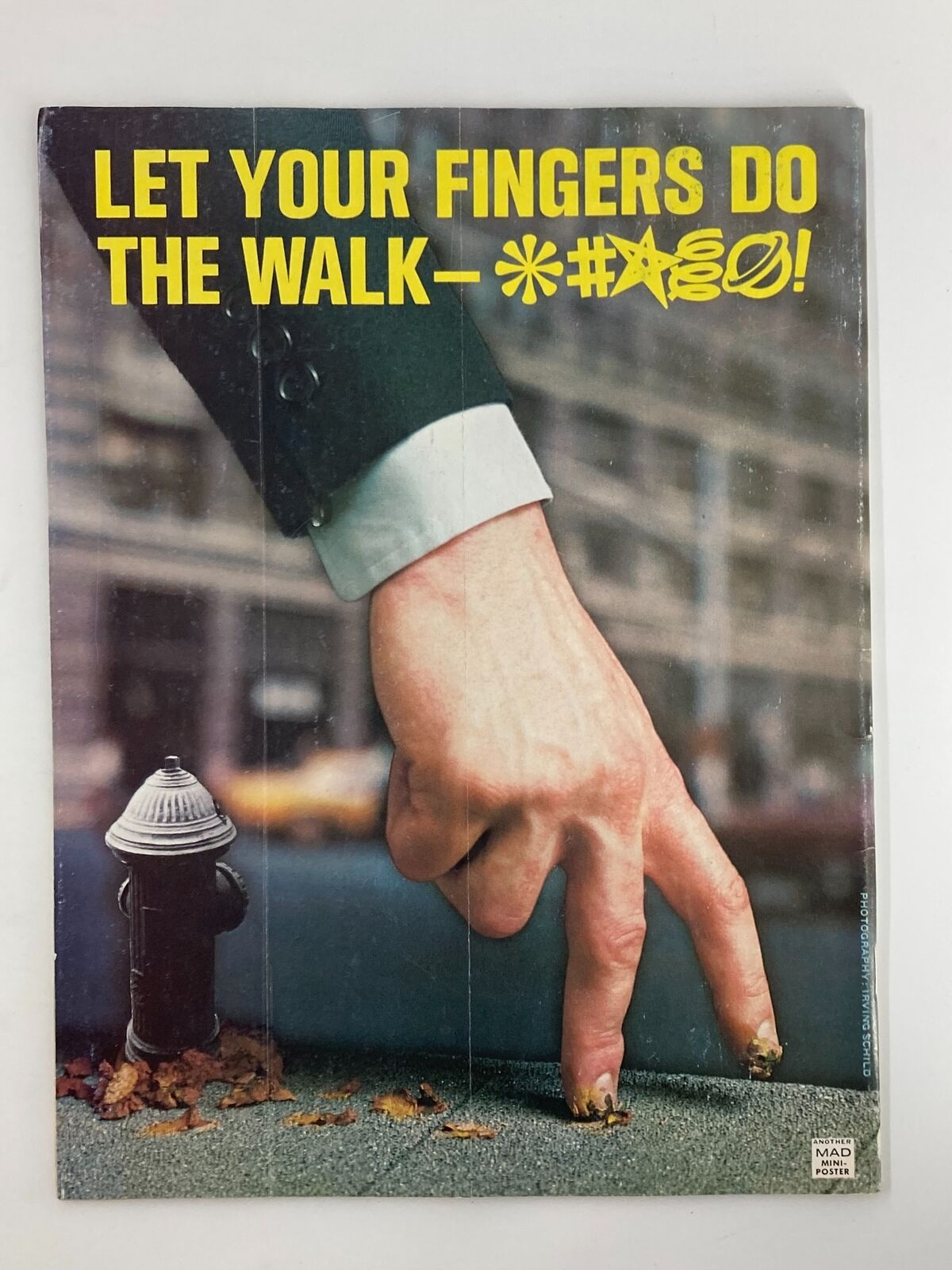 Back cover of Mad Magazine July 1976 No. 184 with a humorous graphic of a hand walking on fingers, encapsulating 1970s satire.