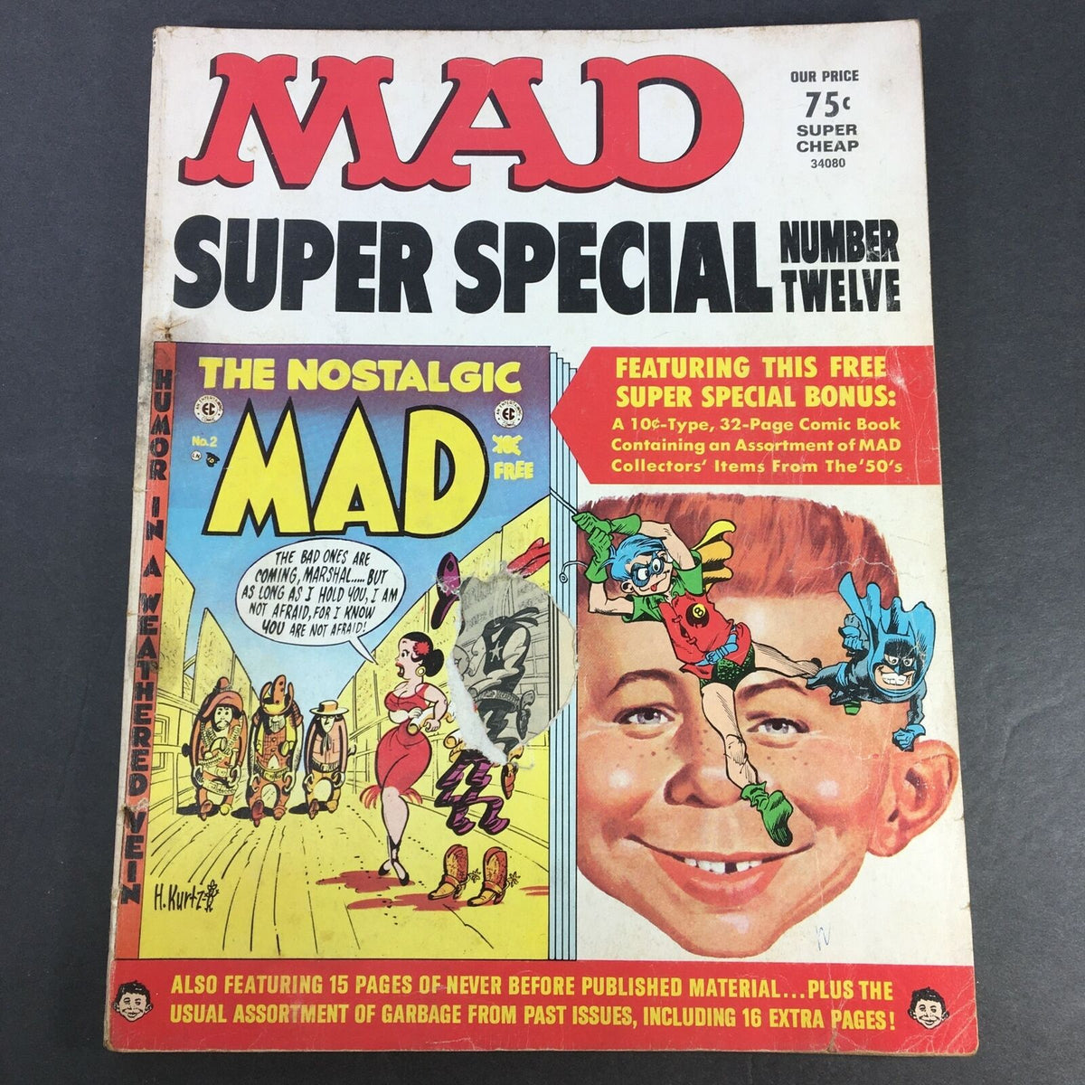 Cover of Mad #12 Super Special 1973 titled 'Humor in Weathered Vein / Batman and Robin'. Features colorful comic art, including characters and announcements about included content such as a free comic book feature and nostalgic elements from the 1950s.