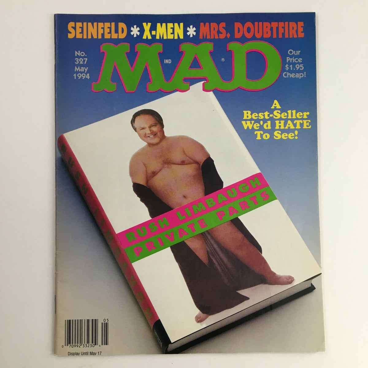 Mad Magazine May 1994 #327 cover featuring Rush Limbaugh in a humorous portrayal, highlighting the comic's satirical take on politics in the 90s. The magazine is noted for its cultural commentary and vintage appeal.