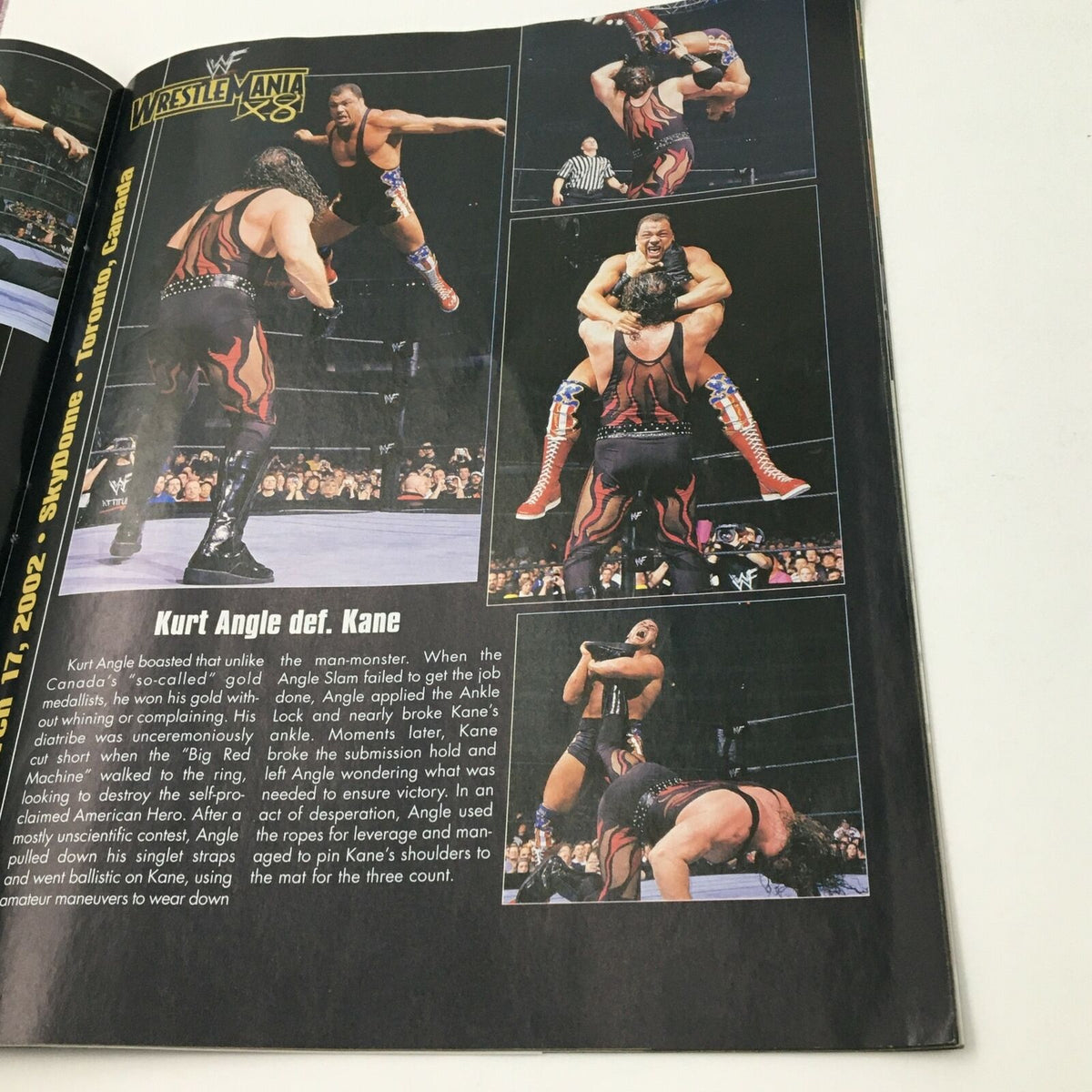 Page in WWE Magazine June 2002 featuring a match synopsis from WrestleMania X8, including Kurt Angle vs. Kane.