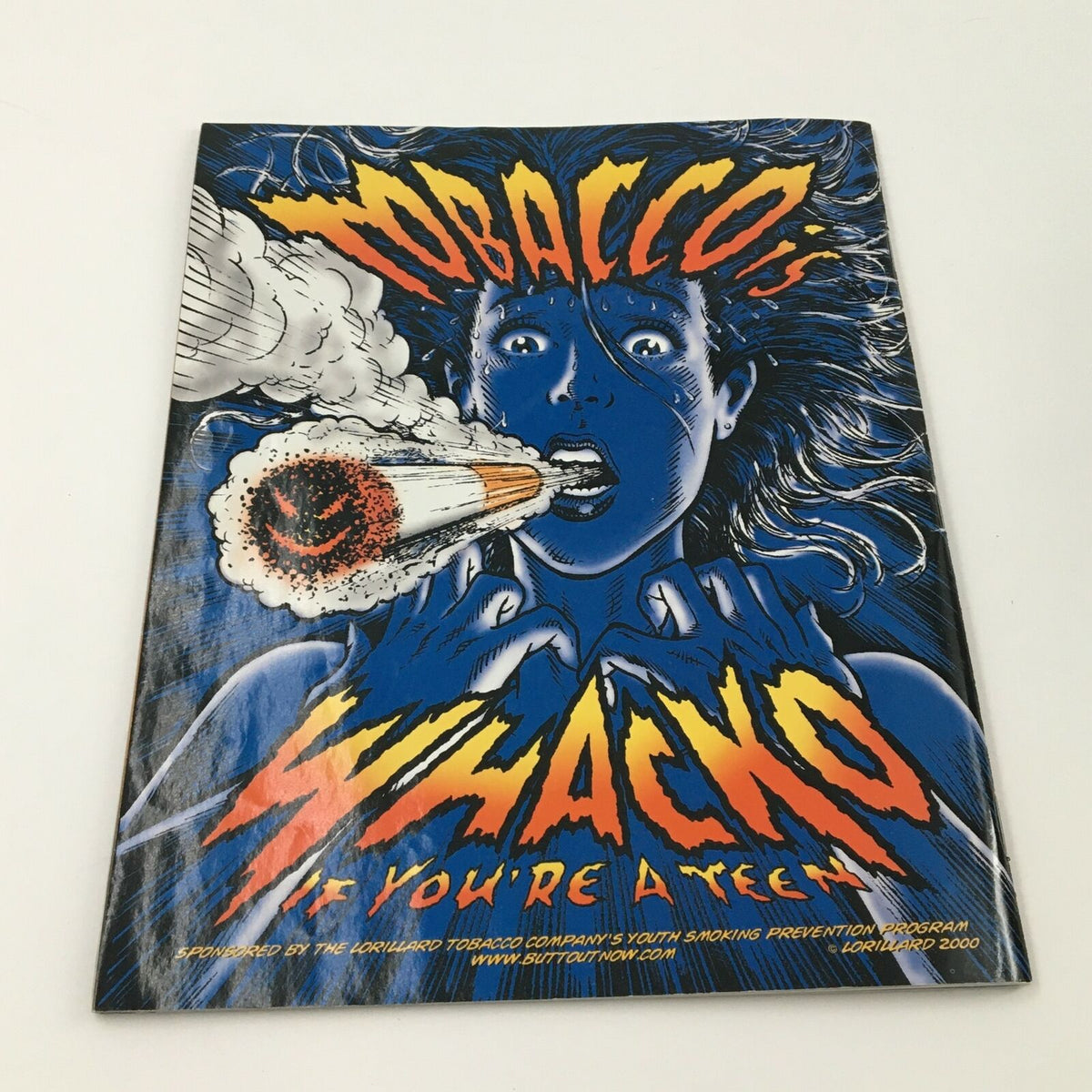 Promotional insert in WWE Magazine June 2002 focused on anti-smoking efforts, featuring striking graphics.