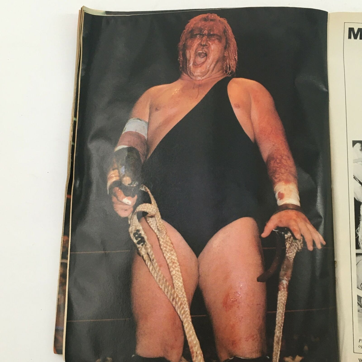 Photo from Wrestling's Main Event Magazine August 1982 showing a muscular wrestler in a one-piece costume, embodying the intensity and dramatic storytelling of professional wrestling.