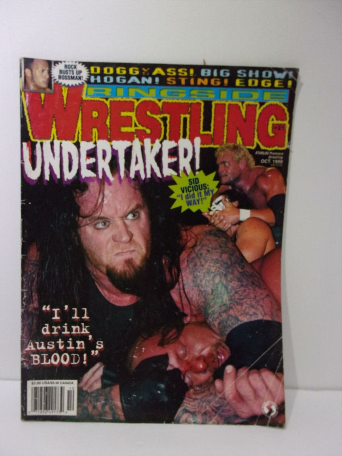 Ringside Wrestling magazine featuring the Undertaker on the cover with the text "I'll drink Austin's Blood!" October 1999 issue. The cover showcases a wrestling match with the Undertaker in action.