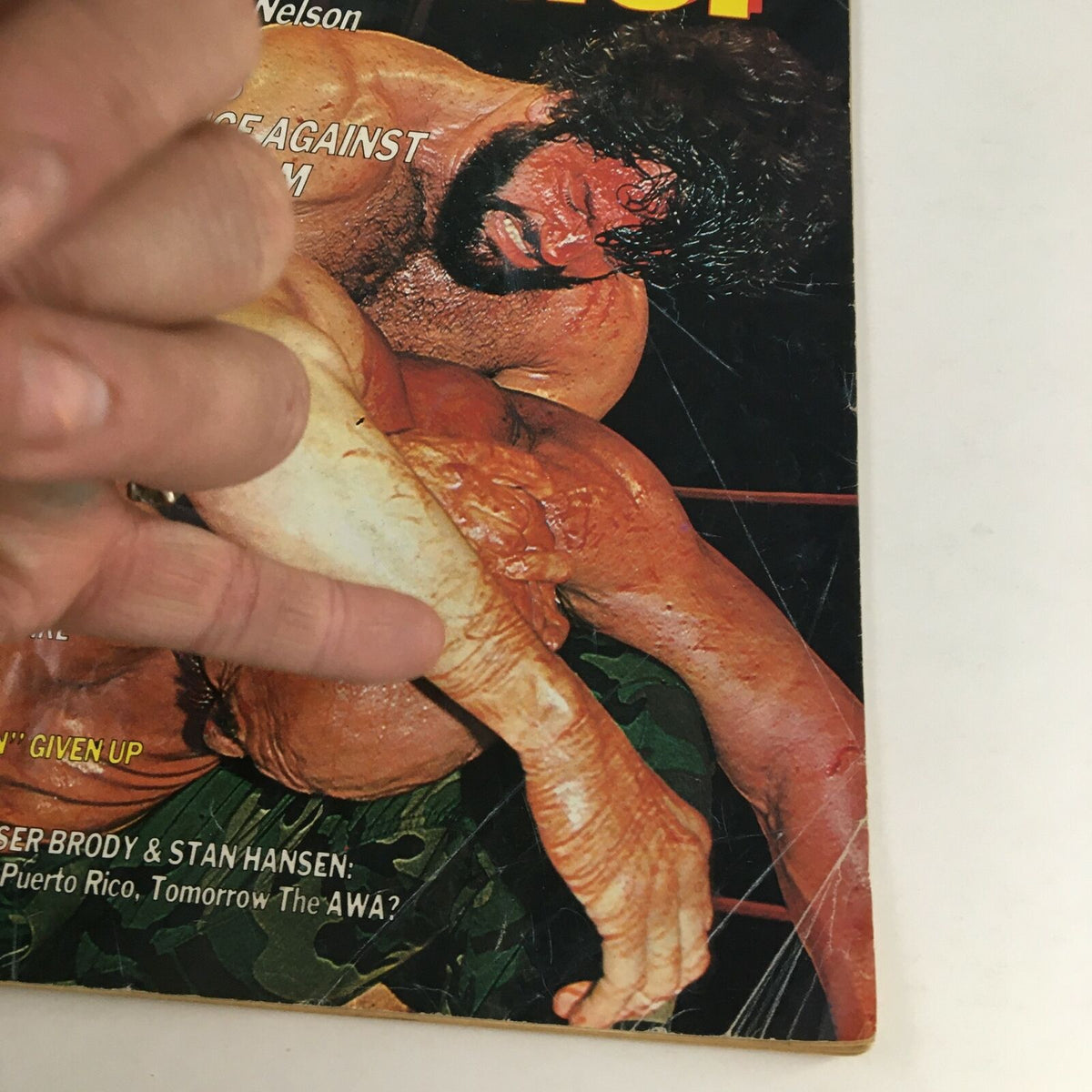 Close-up view of The Wrestler Magazine November 1984 cover focusing on Billy Jack and Superstar Graham, emphasizing the intense wrestling match.