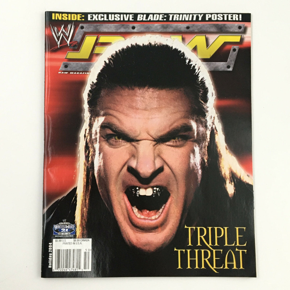 Cover of WWE Raw Magazine Holiday 2004 featuring Triple H with an intense expression, showcasing the title 'TRIPLE THREAT'.