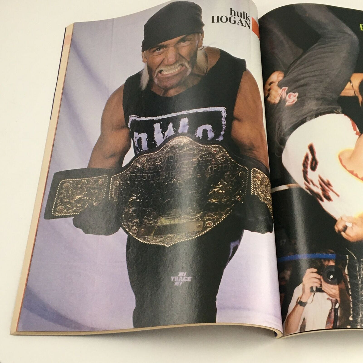 Prominent image of Hulk Hogan holding the heavyweight championship belt from Wrestling Yearbook Winter 1997, representing a significant figure in wrestling history.