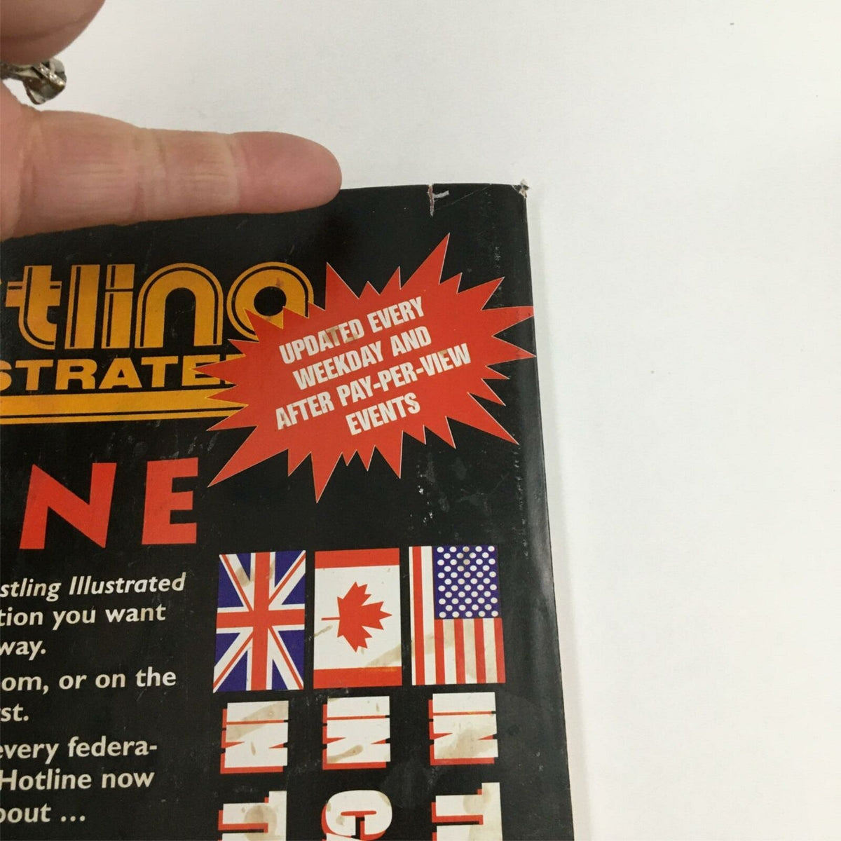 Close-up of the back cover design of Pro Wrestling Illustrated July 1996, emphasizing updates on wrestling events and hotline information.