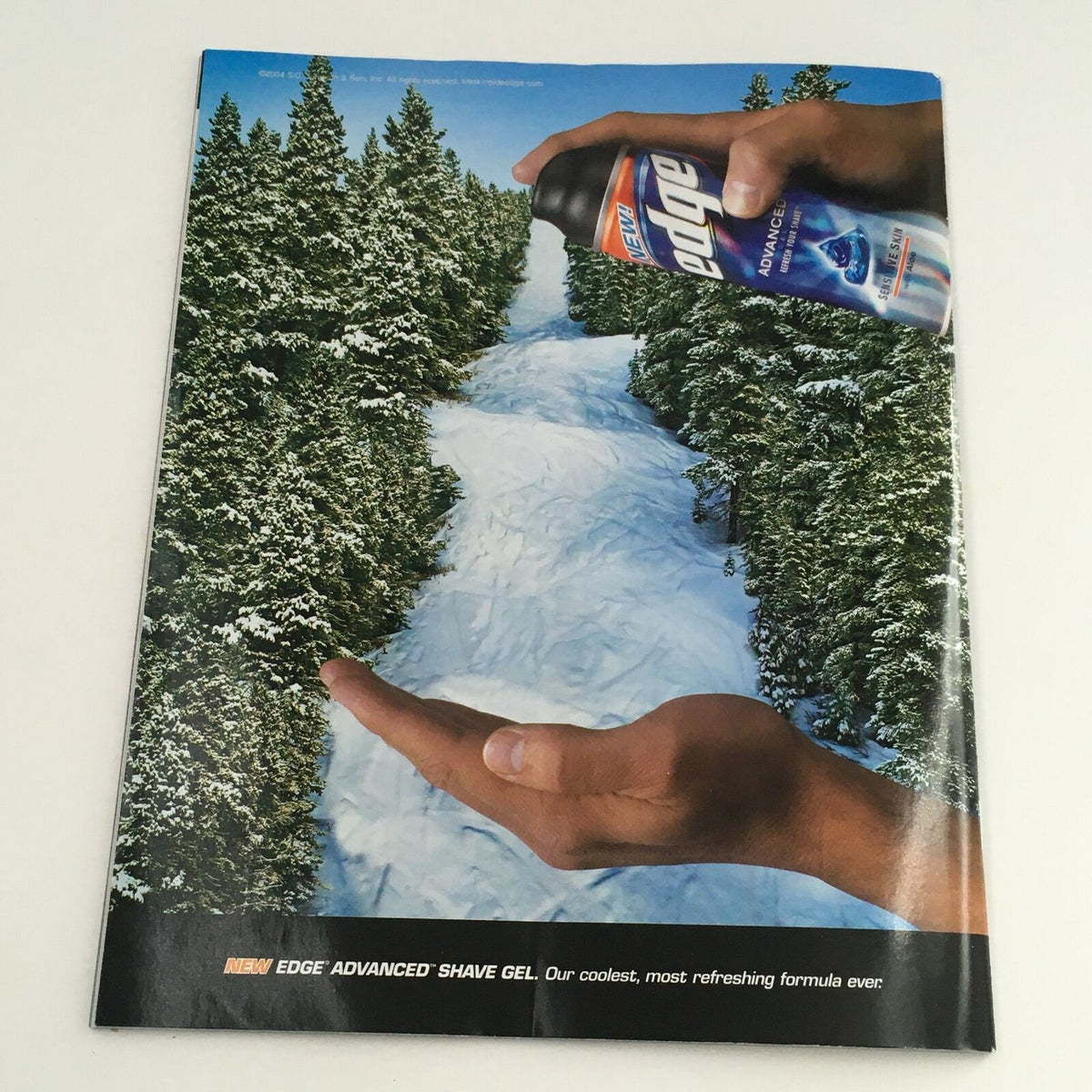 Back cover of WWE Smack Down Magazine January 2005 showcasing a product advertisement for Edge Advanced Shave Gel amidst a scenic background.