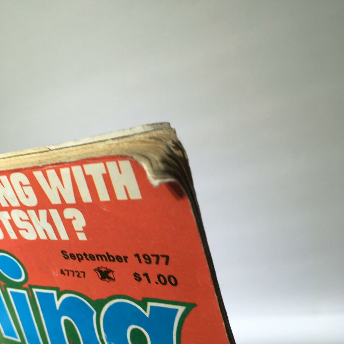 Edge of the cover of Inside Wrestling Magazine, September 1977, showing minor wear and tear, reflecting its vintage condition.