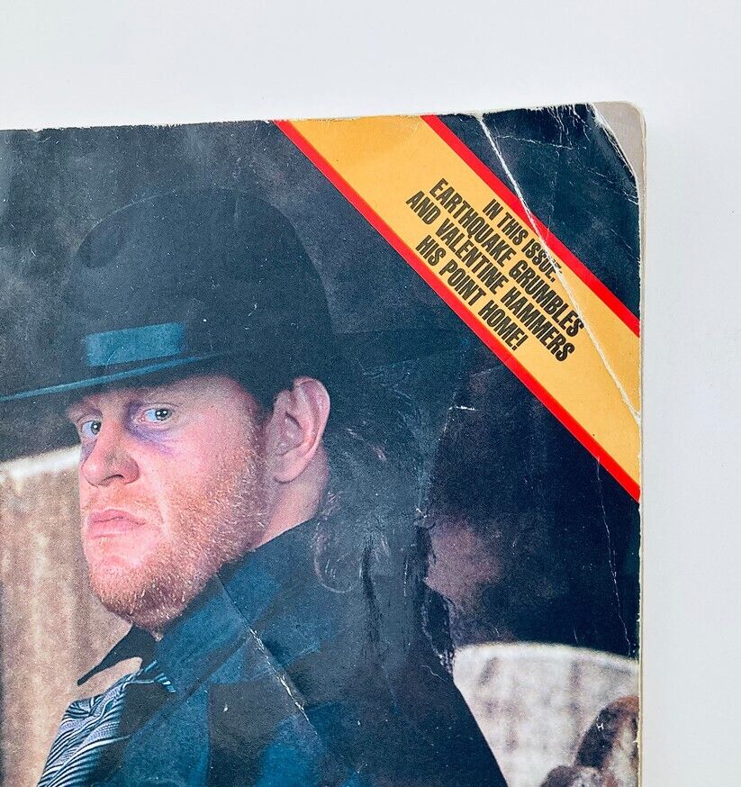 Cover of WWF World Wrestling Federation Magazine May 1991 featuring The Undertaker in a black hat and suit, highlighting vintage wrestling history.