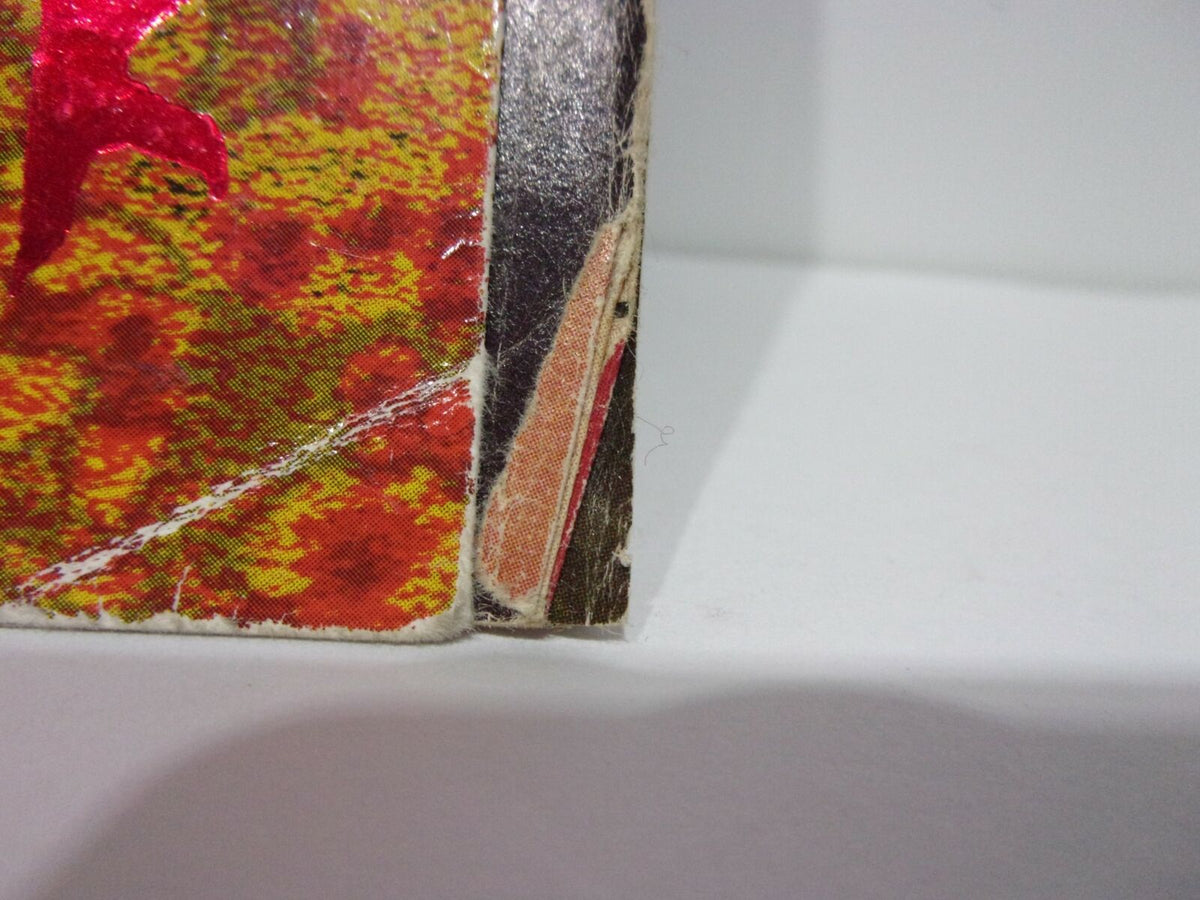 Close-up of the corner of the World of Wrestling WOW Magazine Sting To Hell and Back showing minor wear and edges, highlighting its excellent condition overall.
