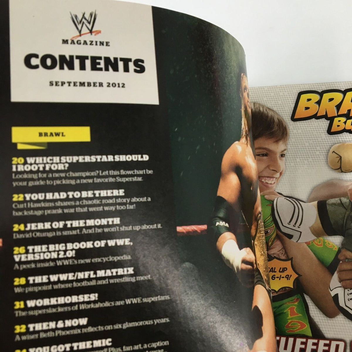 Another inside page of WWE Magazine September 2012 showcasing the table of contents, details on wrestling features, and a promotional ad for Brawlin Buddies.