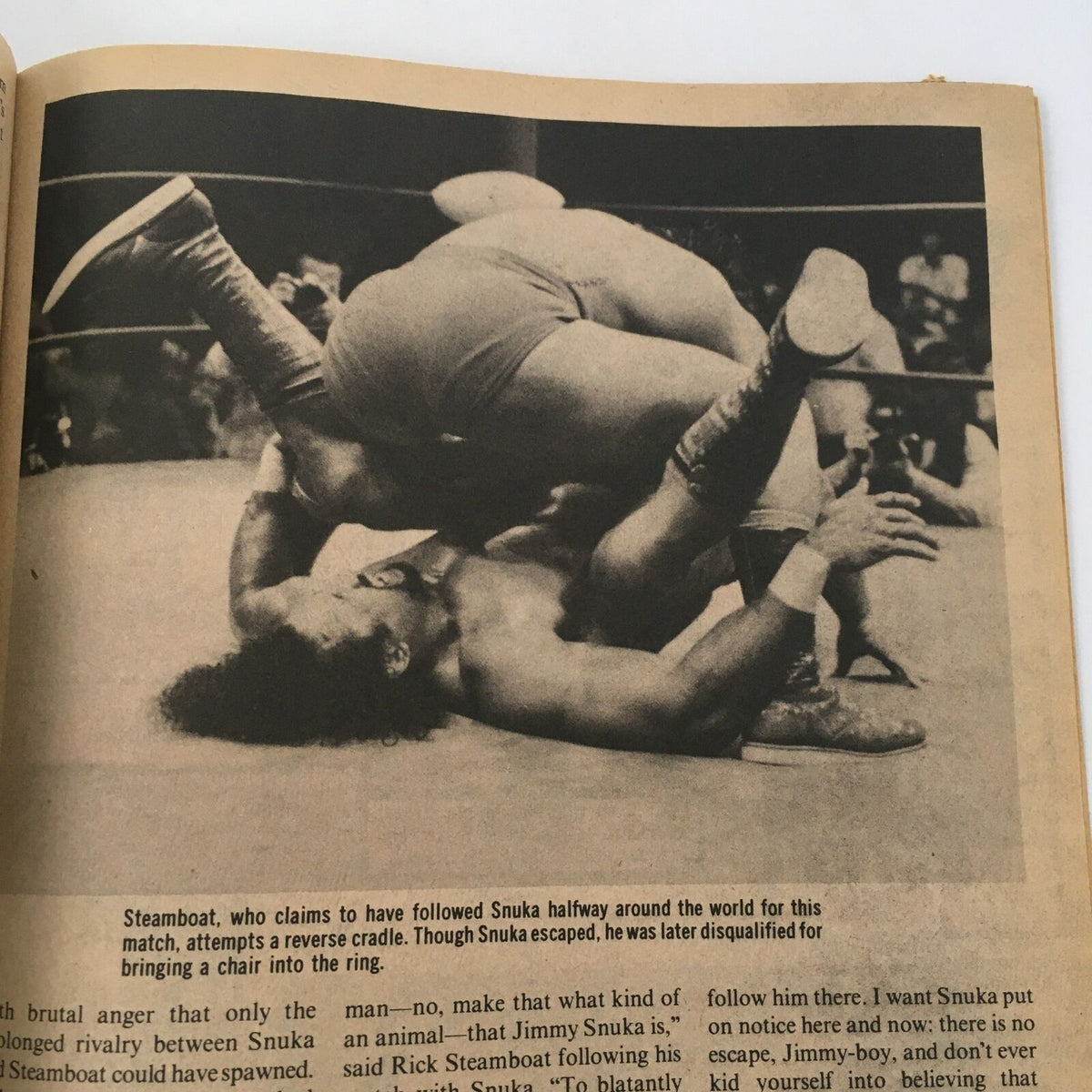 Inside page of The Wrestler Magazine December 1981 depicting a wrestling match between Steamboat and Snuka, highlighting a dramatic moment where Steamboat attempts a reverse cradle.