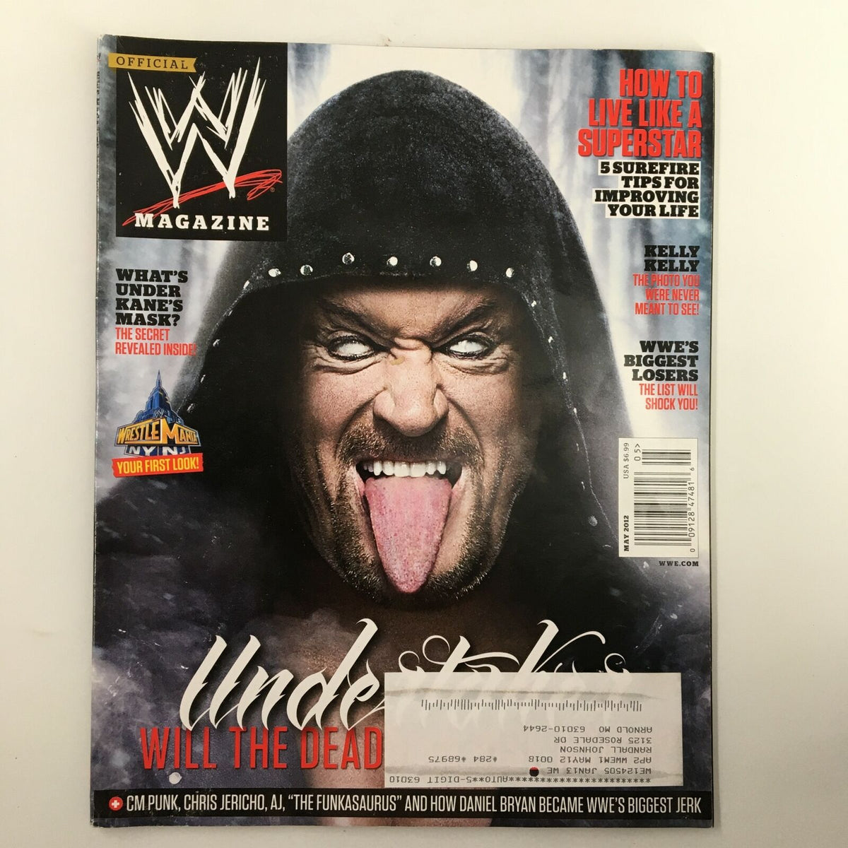 WWE Magazine May 2012 cover featuring The Undertaker with an intense expression, highlighting iconic wrestling personalities like Joey Styles, Kelly Kelly, and Daniel Bryan.