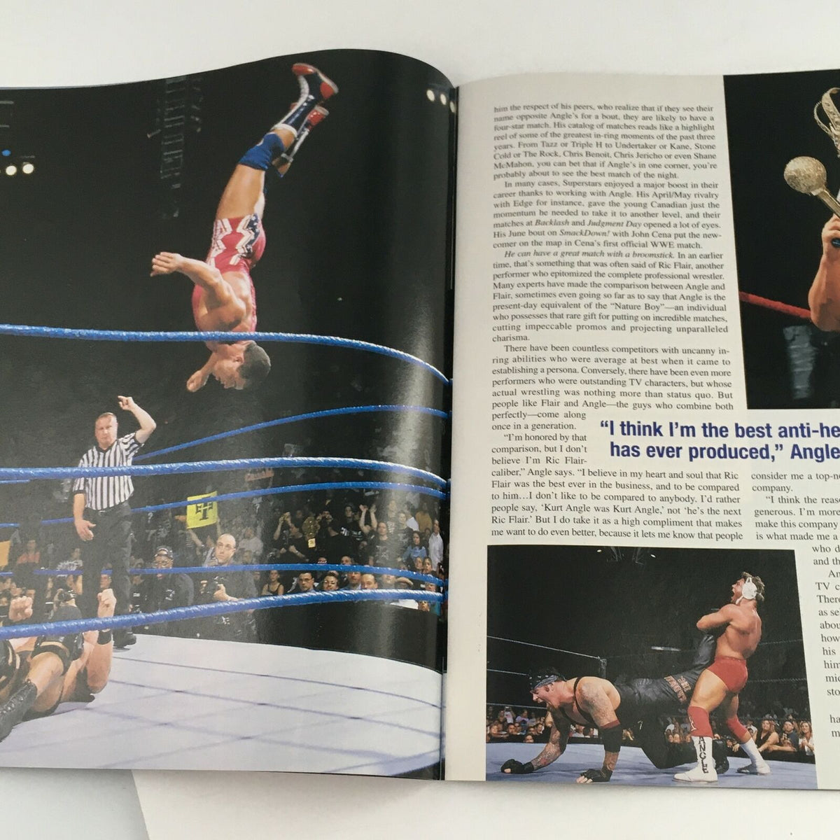Action shot from WWE Raw Magazine October 2002 displaying Kurt Angle performing a high-flying maneuver in the wrestling ring, capturing the excitement of early 2000s wrestling.