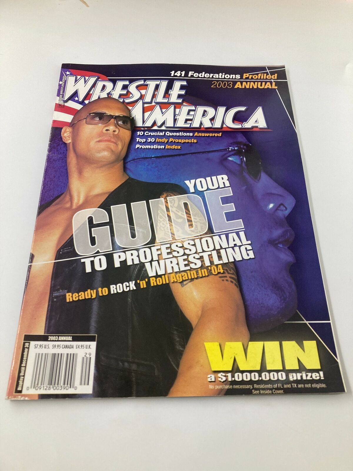 Wrestle America Magazine 2003 featuring Dwayne "The Rock" Johnson on the cover, showcasing a guide to professional wrestling and a chance to win a prize.