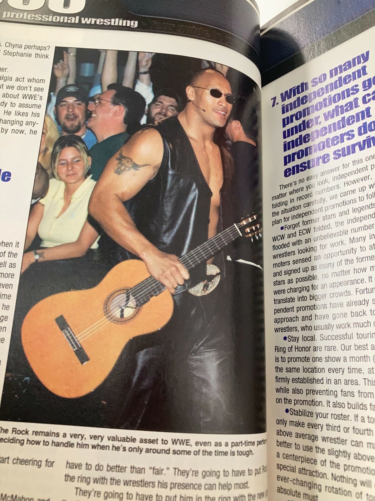 Dwayne 'The Rock' Johnson performing with a guitar, as featured in Wrestle America Magazine 2003.