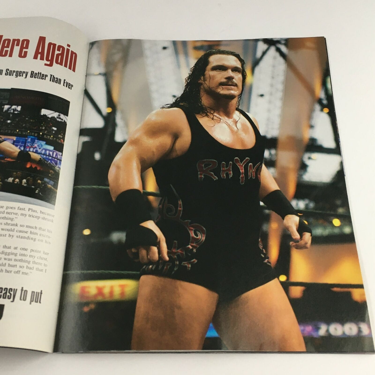 WWE Raw Magazine June 2003 interior image of wrestler Rhyno in action, highlighting his powerful physique and wrestling style.