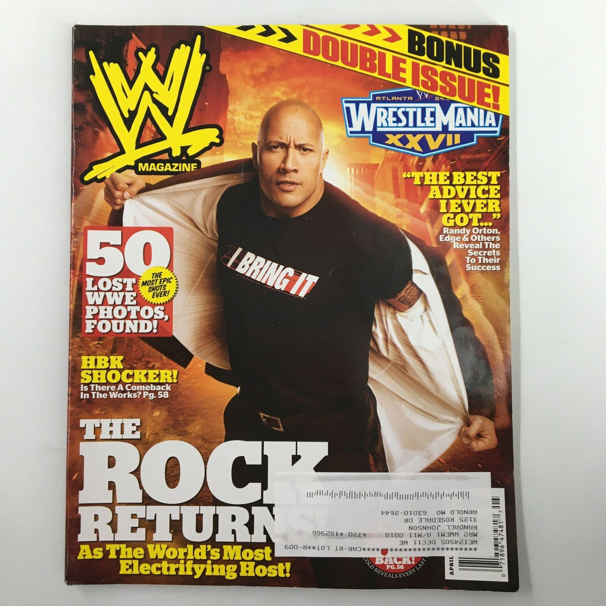 WWE Magazine April 2011 cover featuring The Rock Returns, highlighting 'I BRING IT' slogan, with additional features like Randy Orton and Edge, and a WrestleMania XXVII banner.