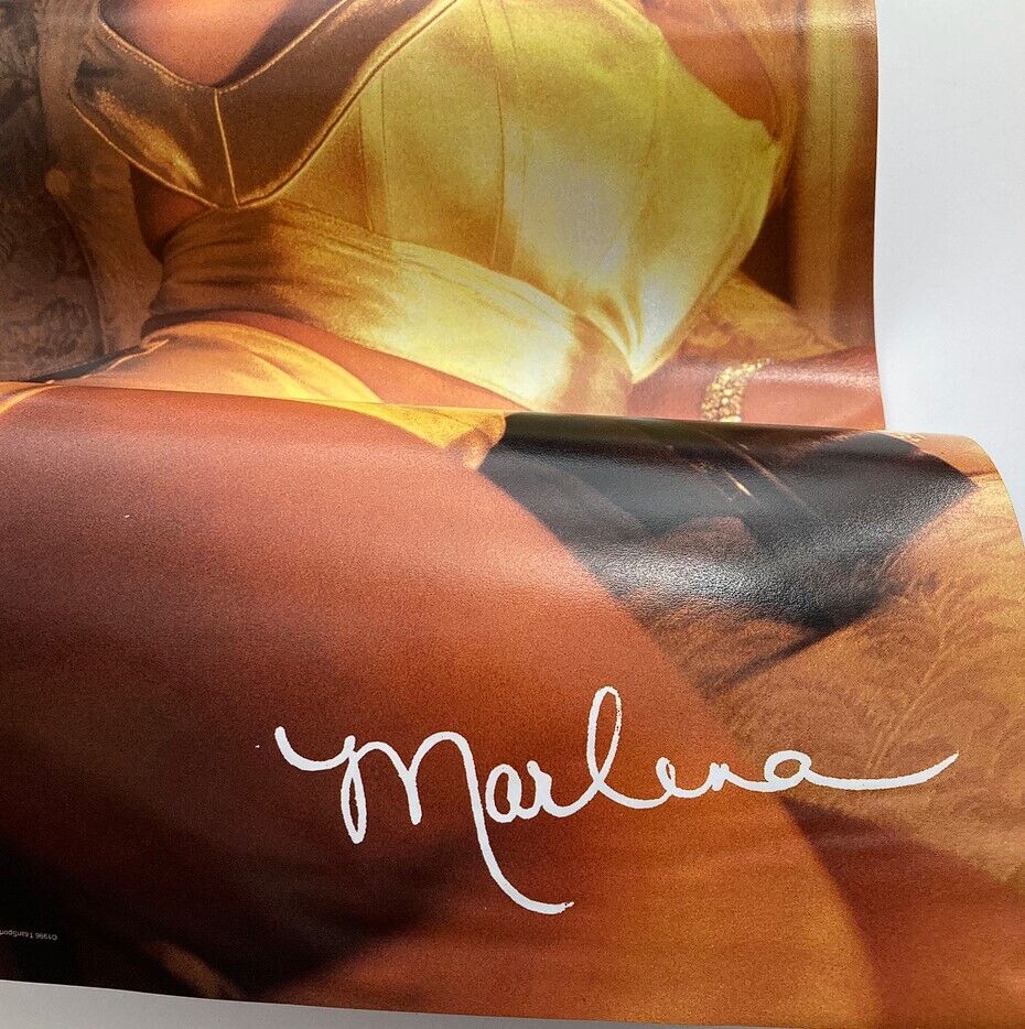 A close-up of a vintage poster featuring Marlena from the WWF Raw Magazine July 1996 edition, showcasing her signature with elegant styling.