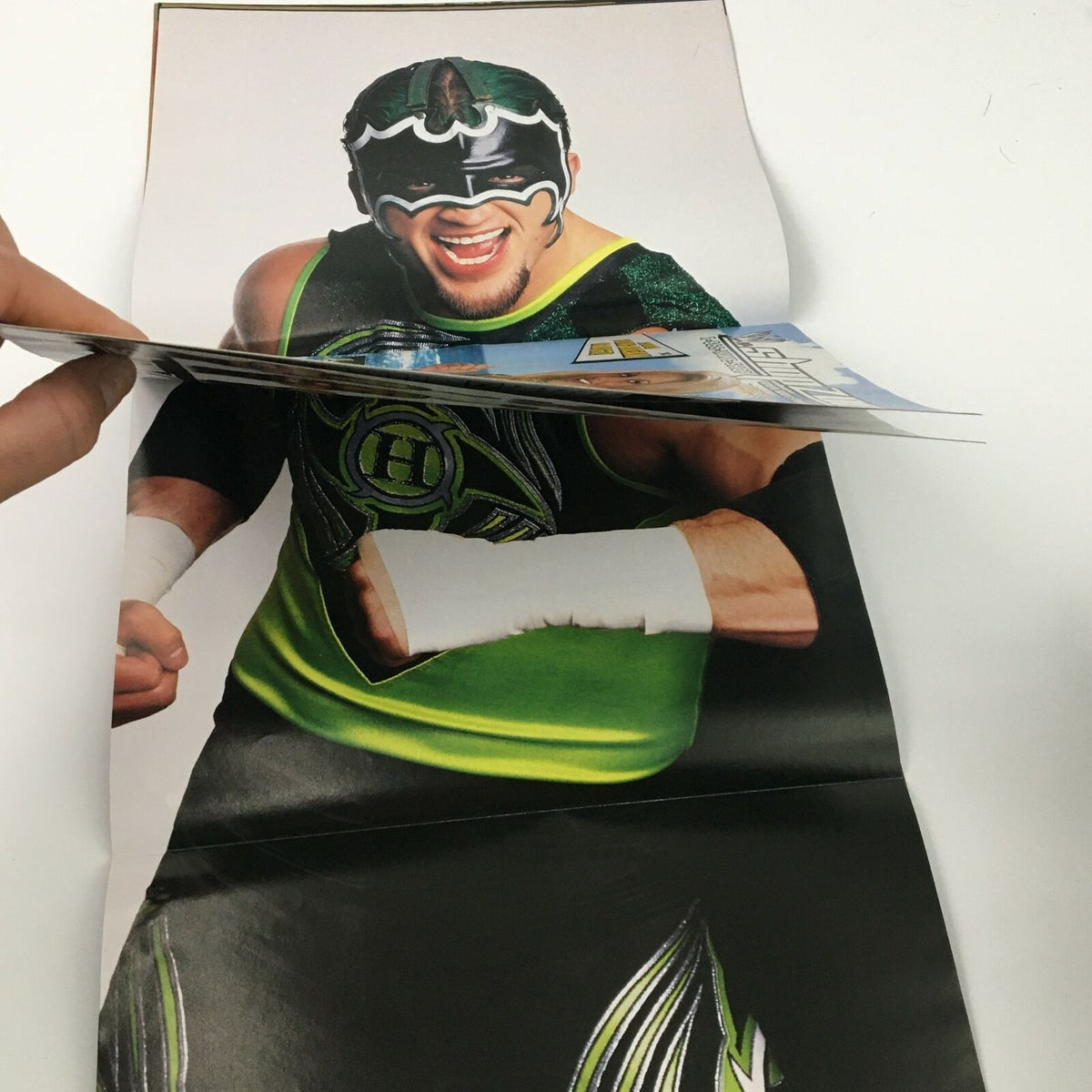 Foldout poster from WWE Magazine April 2003 featuring The Hurricane celebrating.