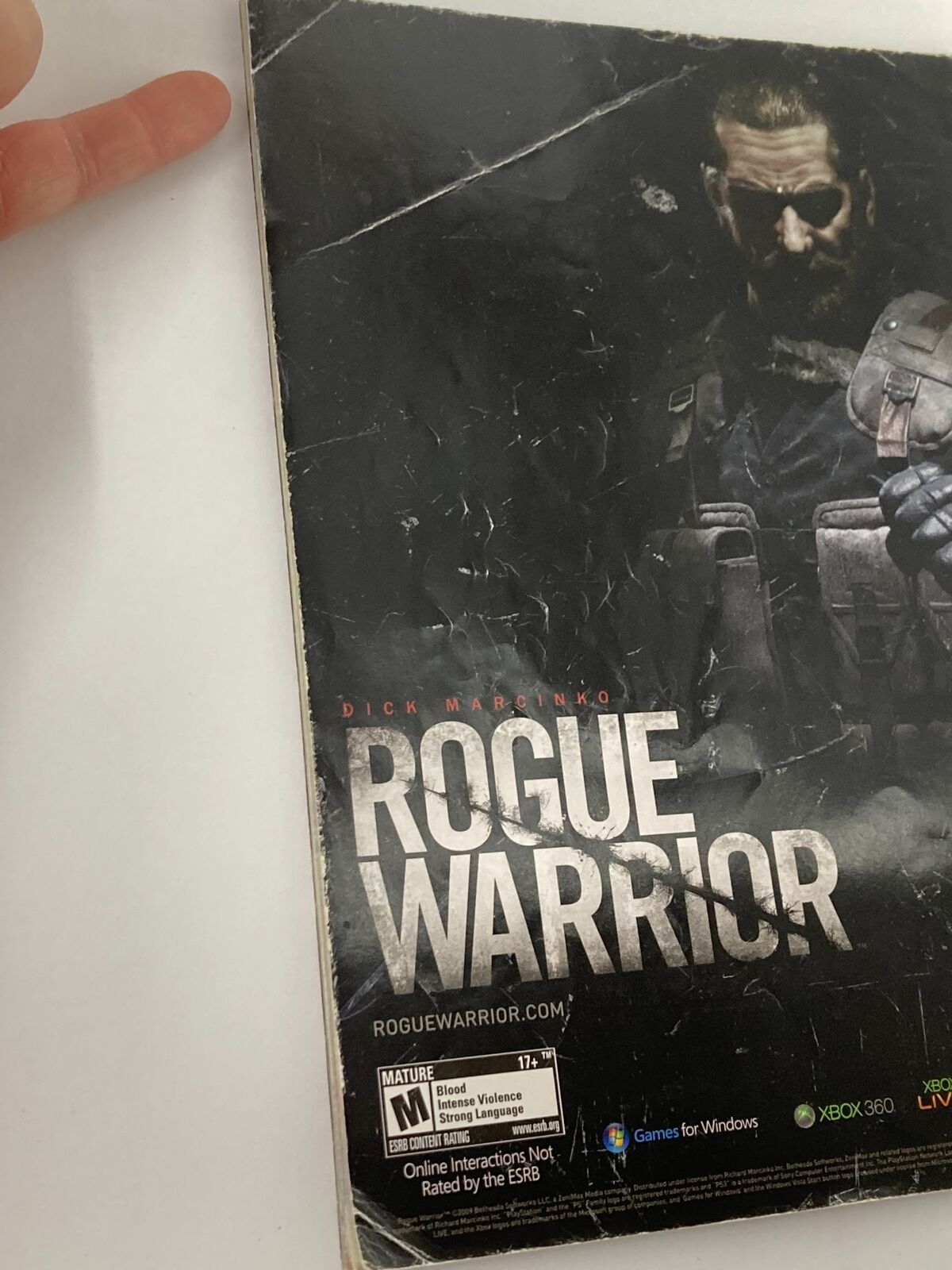 Back cover of WWE Magazine Holiday 2009 highlighting a video game advertisement for 'Rogue Warrior' featuring a gritty design.