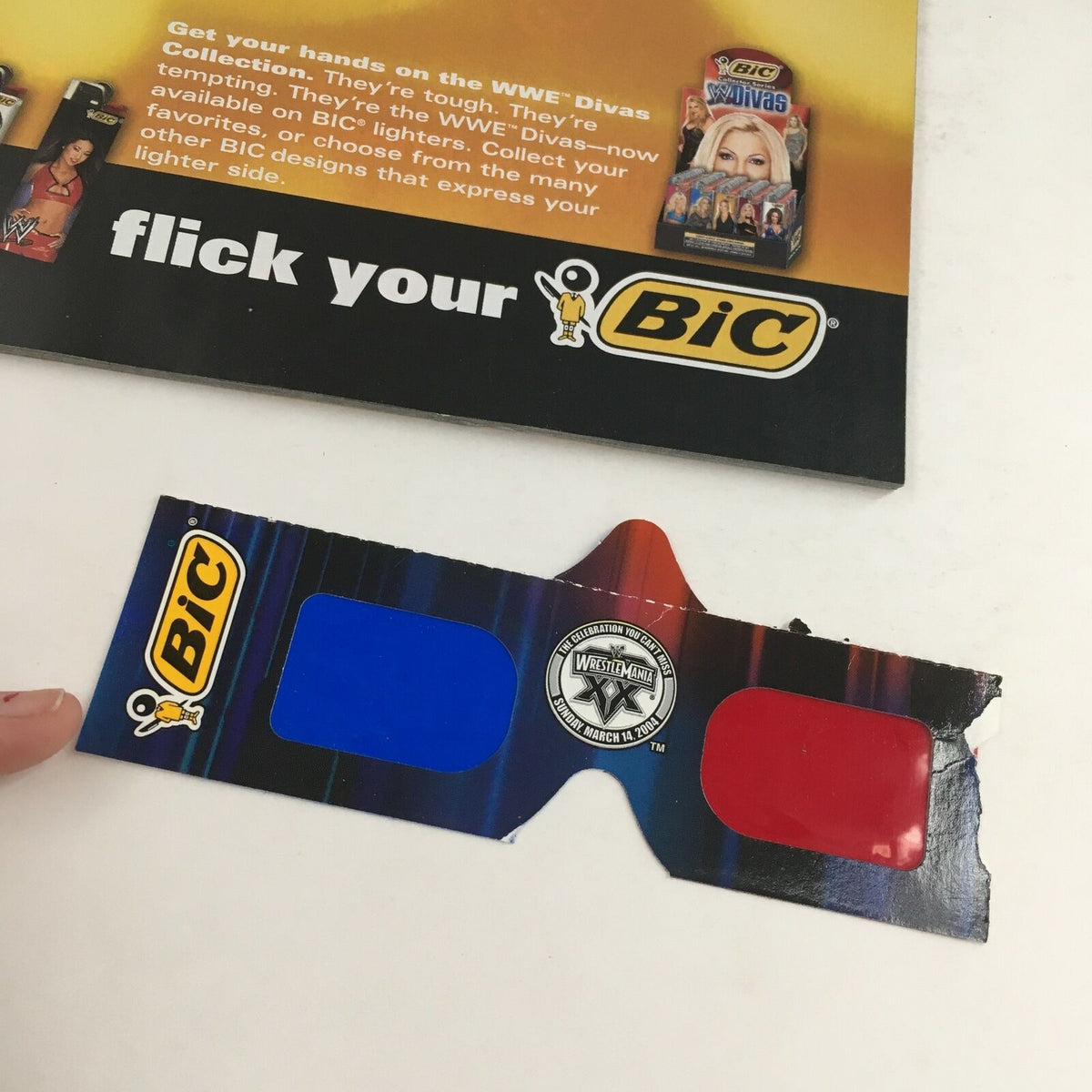 3D glasses from the WWE Wrestle Mania April 2004 magazine, promoting the experience of enhanced viewing.