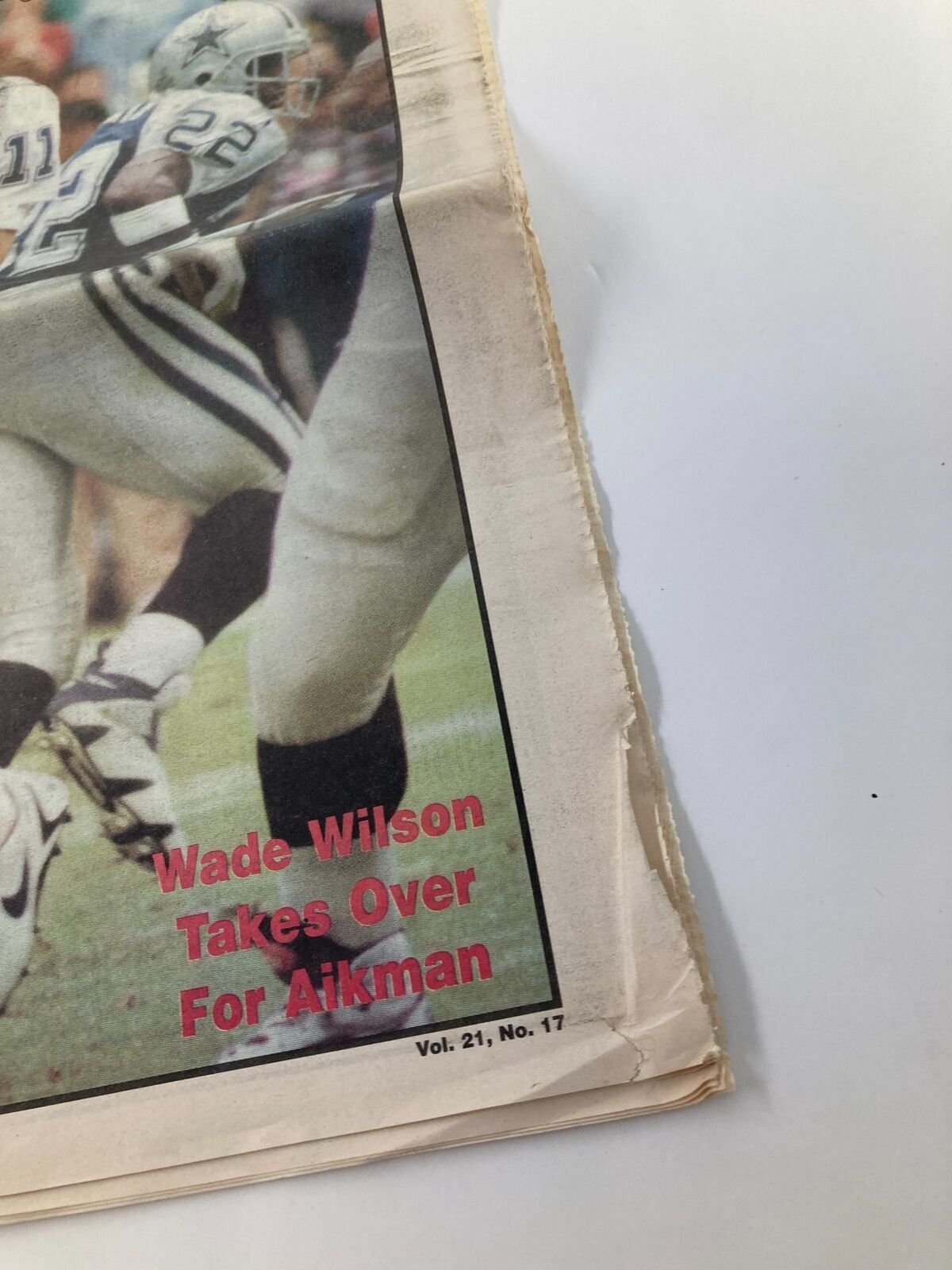 Close-up of the corner of the Dallas Cowboys Weekly Newspaper, Vol. 21, No. 17, highlighting the headline 'Wade Wilson Takes Over For Aikman'.
