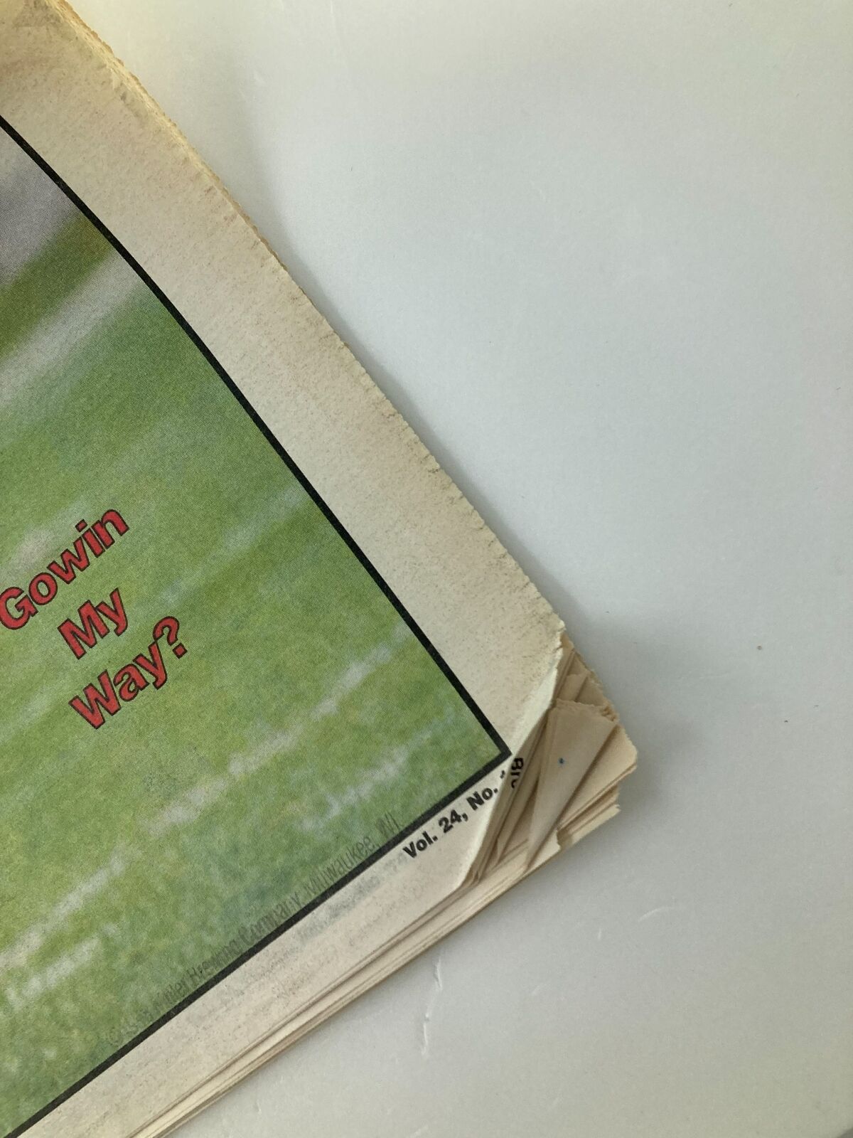 Close-up of the Dallas Cowboys Weekly Newspaper September 19 1998 Vol 24 #14 showing the minor wear and creases, emphasizing the vintage quality.