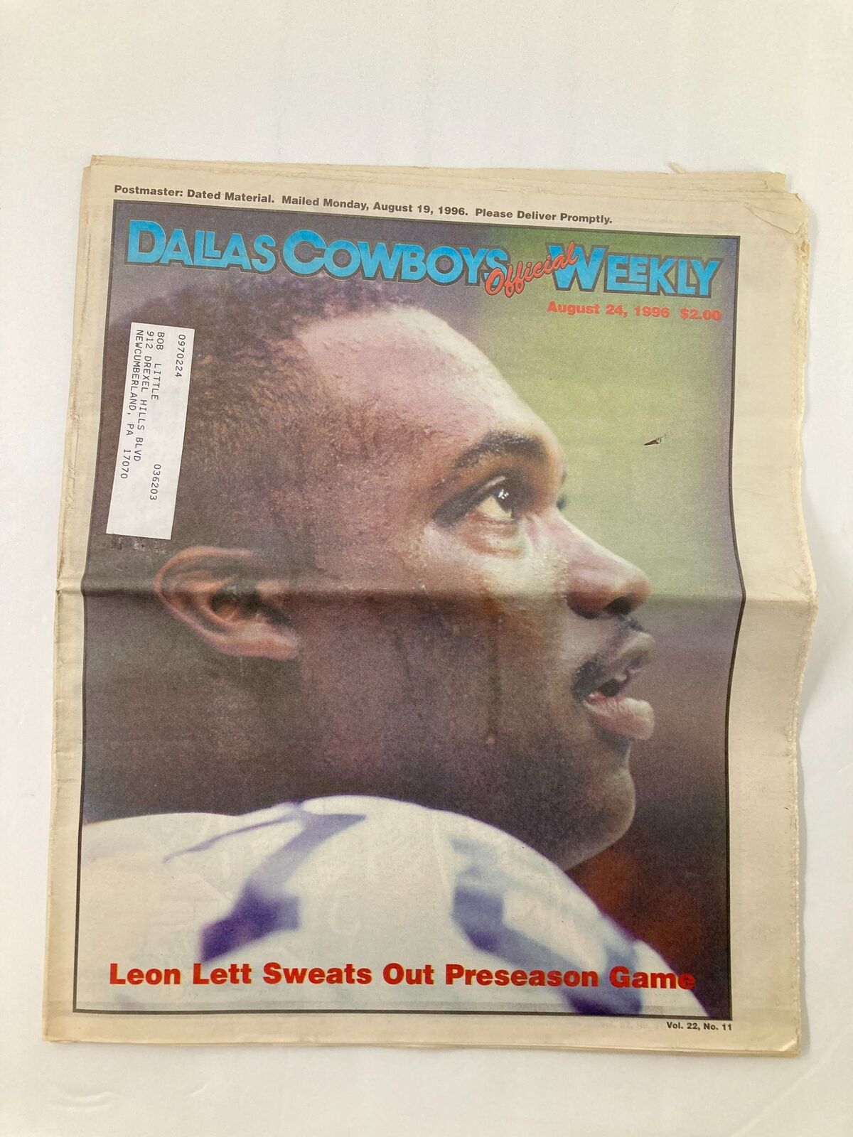 Dallas Cowboys Weekly Newspaper August 24 1996 Vol 22 #11 featuring Leon Lett, showcasing his profile during a preseason game. The newspaper displays minor wear and includes a label on the front.