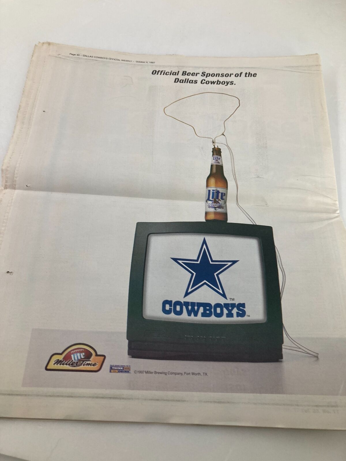 Dallas Cowboys Weekly Newspaper October 4 1997 Vol 23 #17 featuring an advertisement of the Official Beer Sponsor of the Dallas Cowboys with a TV and beer bottle.