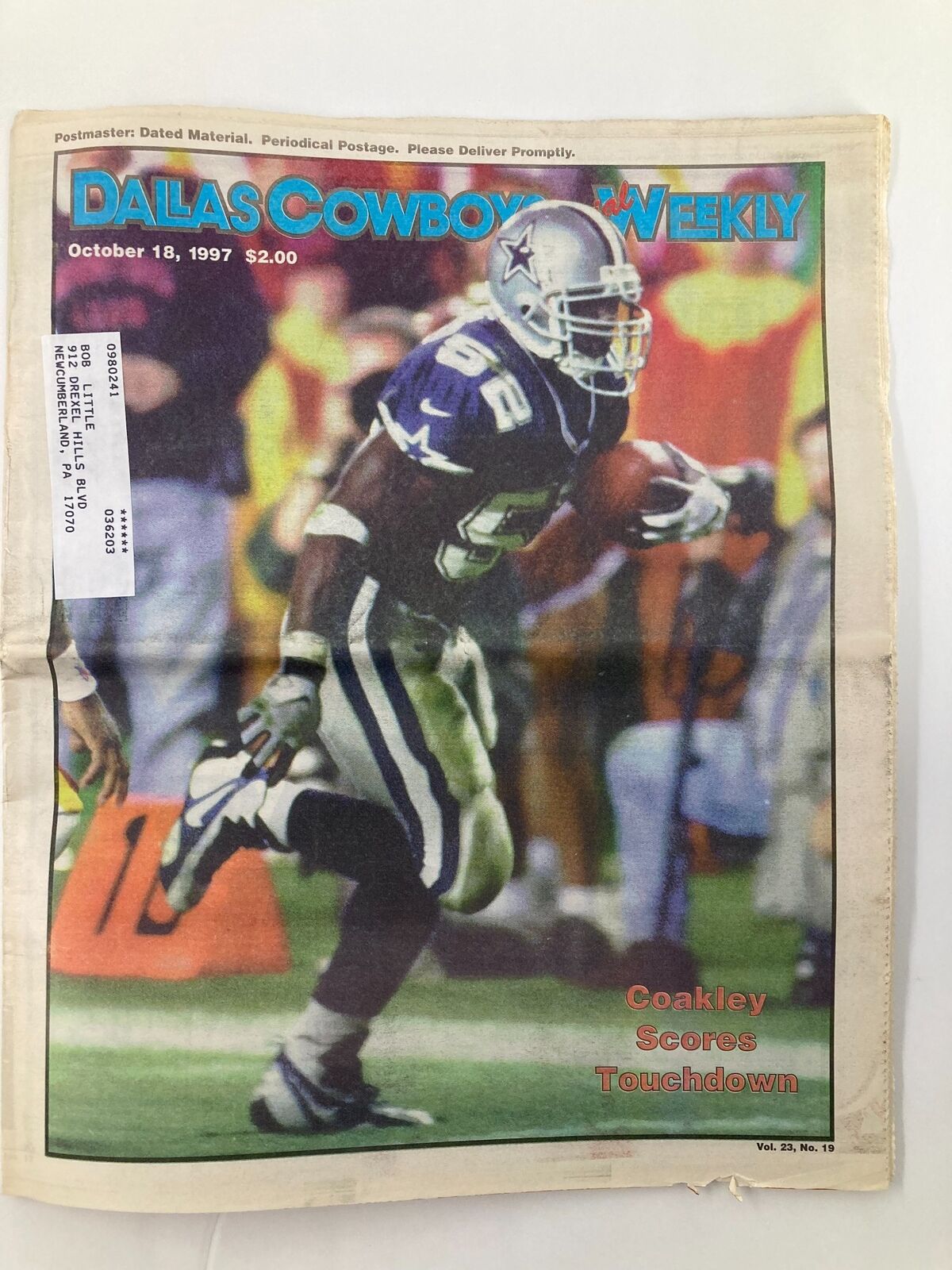 Dallas Cowboys Weekly Newspaper from October 18, 1997. Cover features Dexter Coakley celebrating a touchdown. Vol 23 #19. Good condition with minor wear.