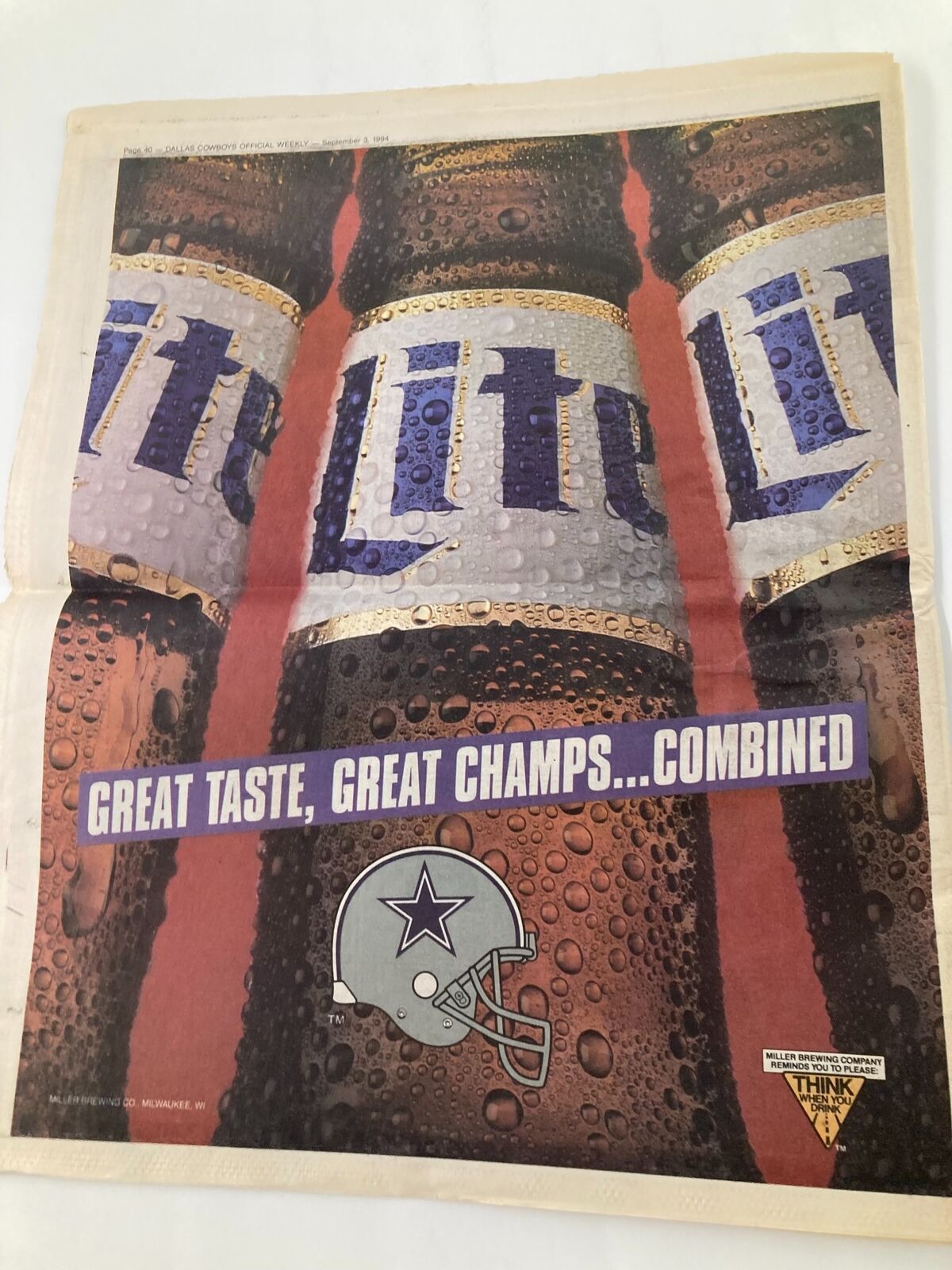 Advertisement in Dallas Cowboys Weekly Newspaper September 3 1994 with a close-up of beer cans promoting a beverage brand along with the Dallas Cowboys logo.