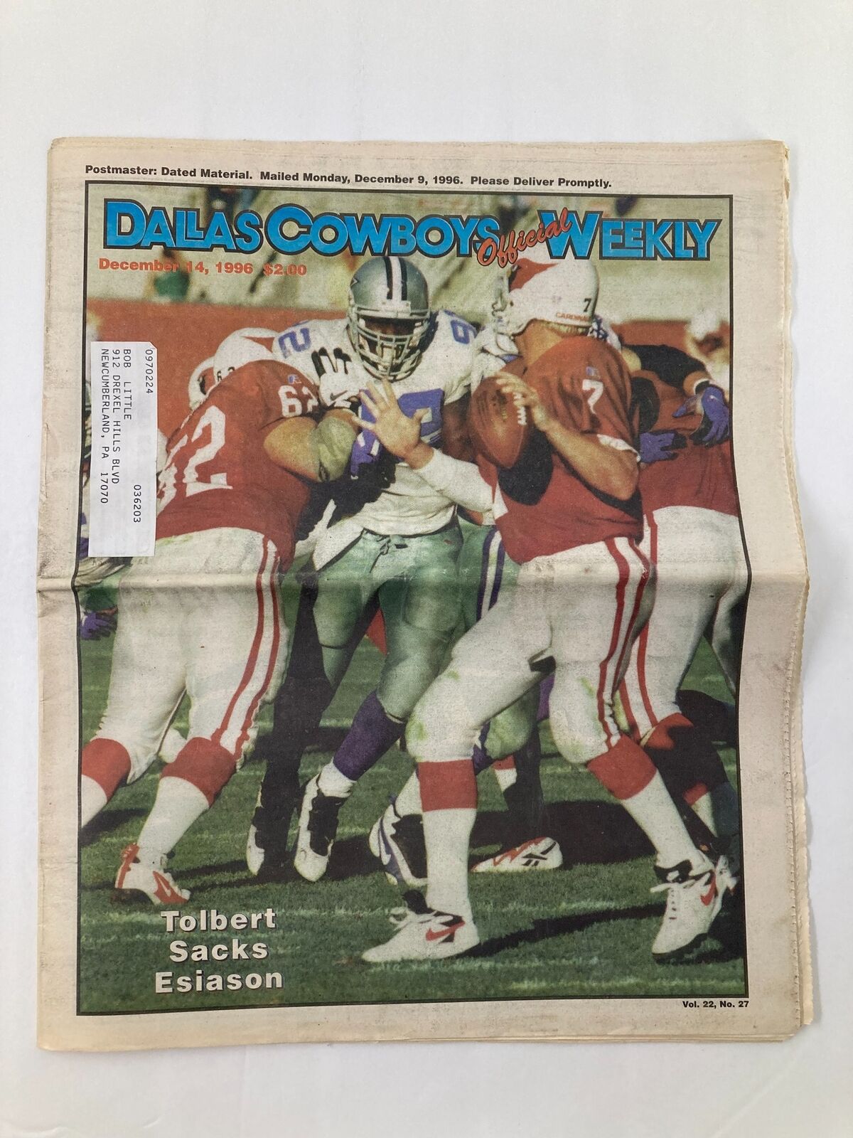 Dallas Cowboys Weekly Newspaper December 14 1996 Vol 22 #27 cover featuring Tony Tolbert under pressure from opposing players during a game, highlighting the Cowboys vs. Cardinals matchup.