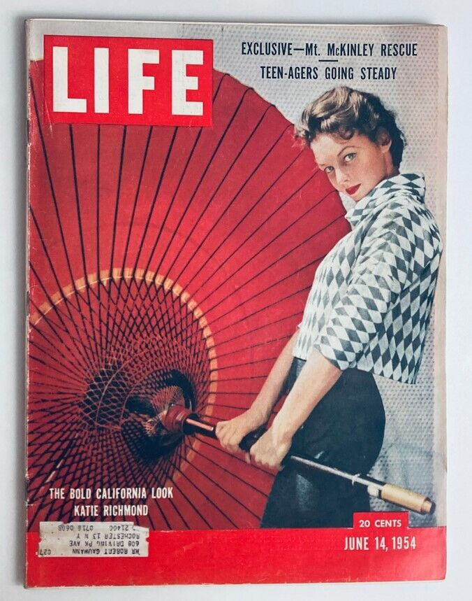 Cover of VTG Life Magazine June 14 1954 featuring a model holding a large red parasol, showcasing the bold California look.
