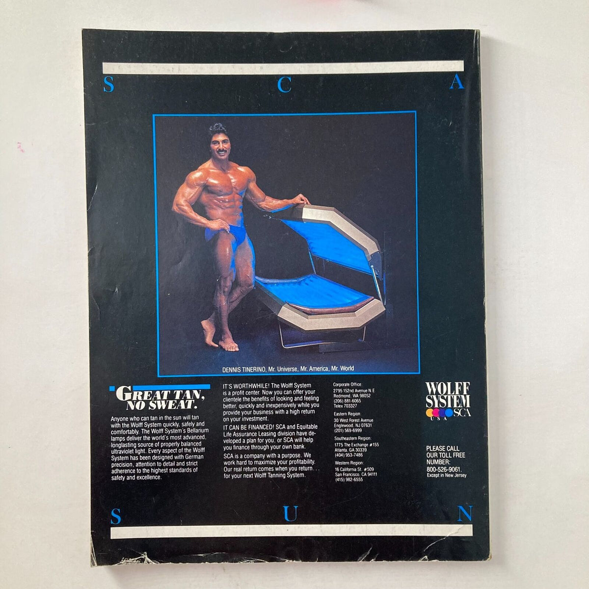 Back cover of Joe Weider's Muscle & Fitness Magazine December 1983 featuring Dennis Tinerino, showcasing a tanning system advertisement with vibrant colors and text highlighting fitness and health benefits.