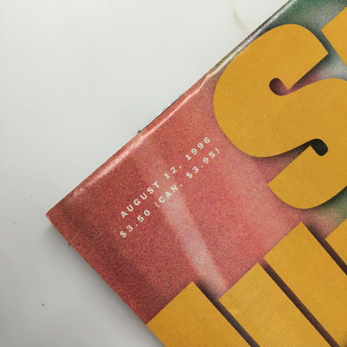 Close-up of the Sports Illustrated Magazine August 12 1996, displaying the publication date and pricing information, emphasizing its status as a collectible vintage magazine.