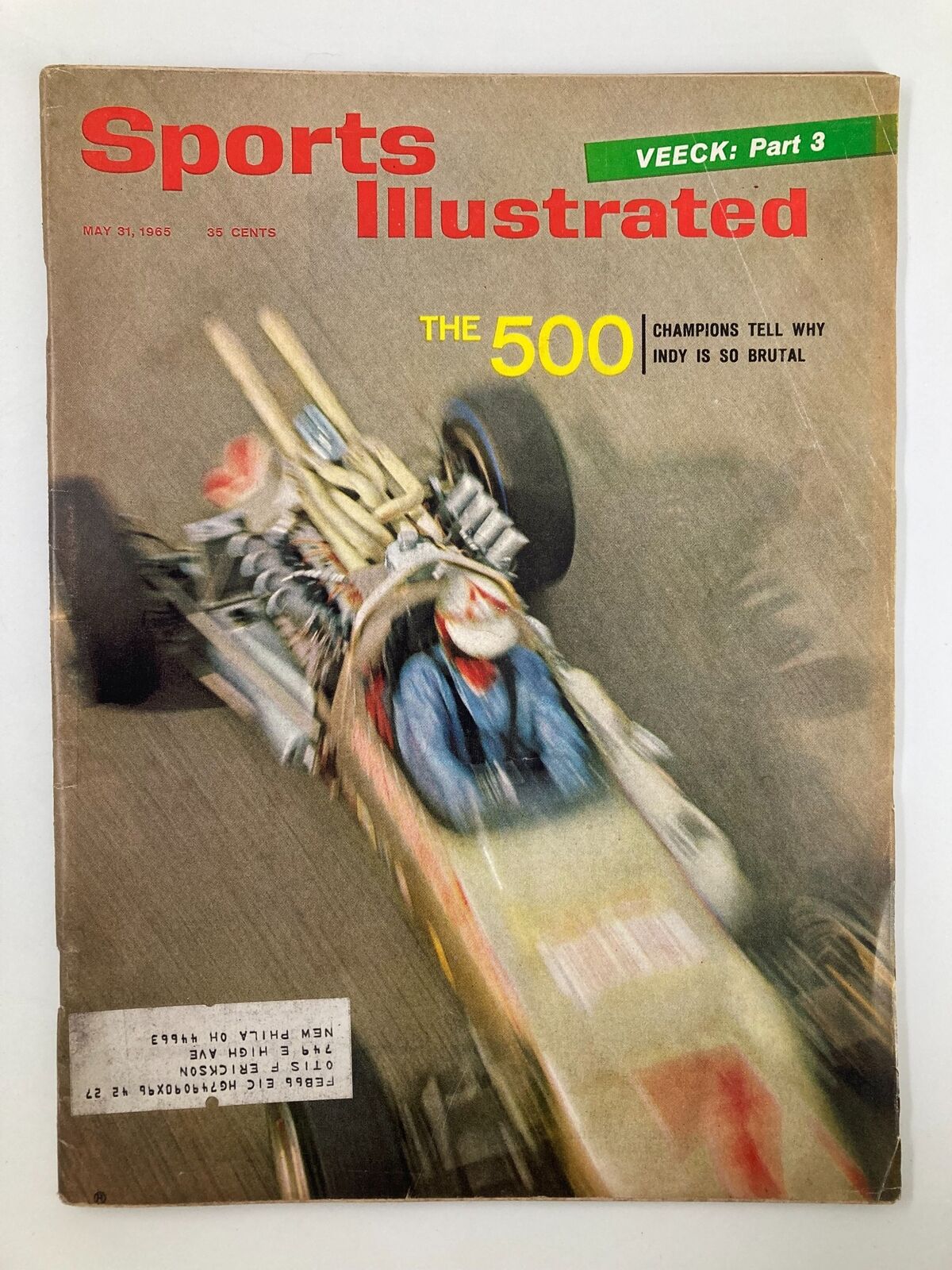 Cover of VTG Sports Illustrated Magazine May 31, 1965, featuring a dynamic image of a race car in motion with the title 'The 500 Champions Tell Why Indy Is So Brutal'.