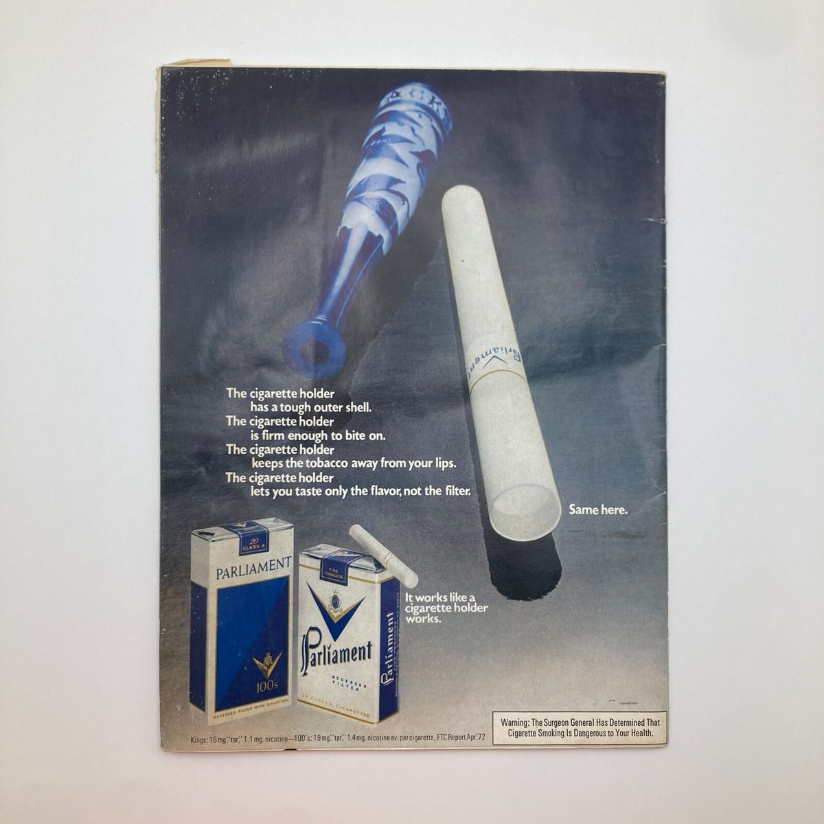 Advertising page from the Vintage Sports Illustrated Magazine July 3 1972, showcasing Parliament cigarettes with a blue cigarette holder and describing its features.