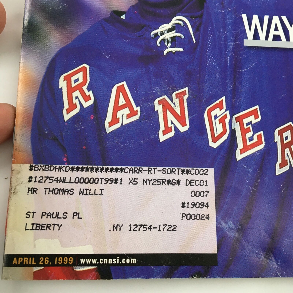 Back cover of Sports Illustrated magazine dated April 26, 1999, displaying Wayne Gretzky's jersey and a mailing label, related to the issue titled 'A Singular Genius'.
