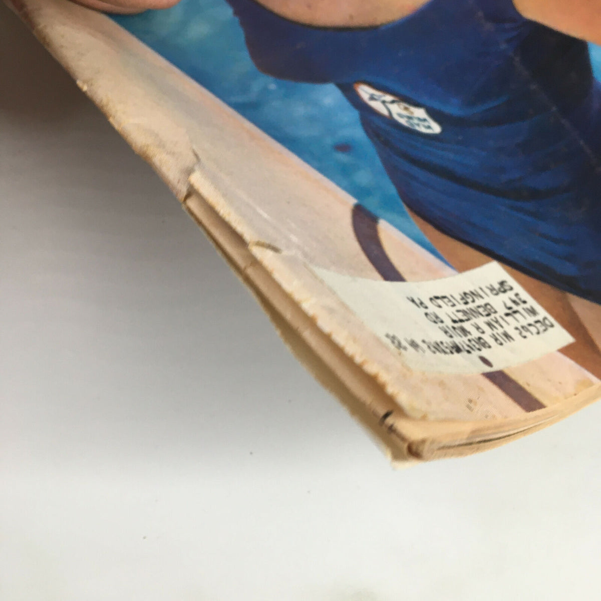 Close-up of the edge of the July 23, 1962 Sports Illustrated Magazine featuring Barbara McAlister. Highlights the magazine's wear and tear while maintaining its vintage charm.