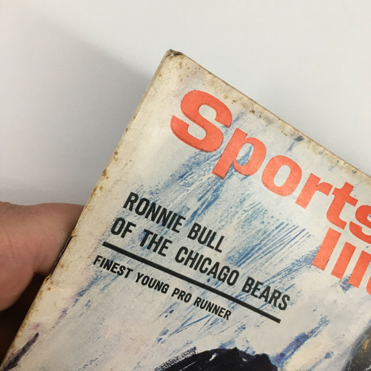 Another close-up of the cover of the Vintage Sports Illustrated magazine, October 14, 1963, with emphasis on the title and mention of Ronnie Bull of the Chicago Bears.