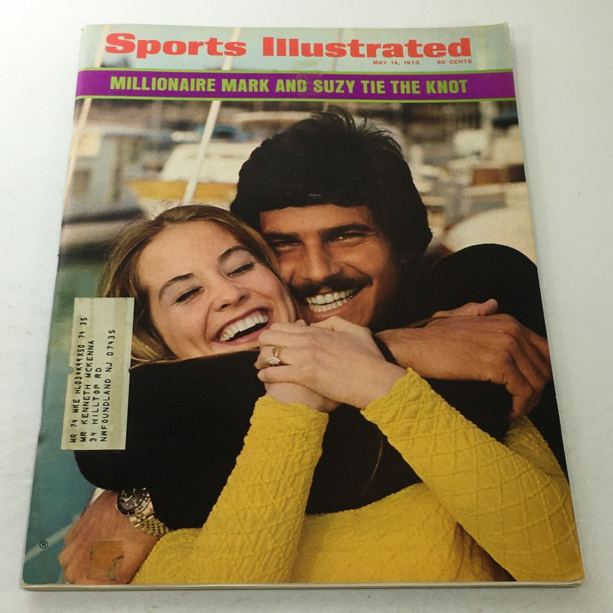 Cover of Sports Illustrated magazine from May 14, 1973 featuring the title 'Millionaire Mark and Suzy Tie The Knot'. The cover showcases a couple embracing, with Mark and Suzy smiling joyfully against a backdrop of boats.